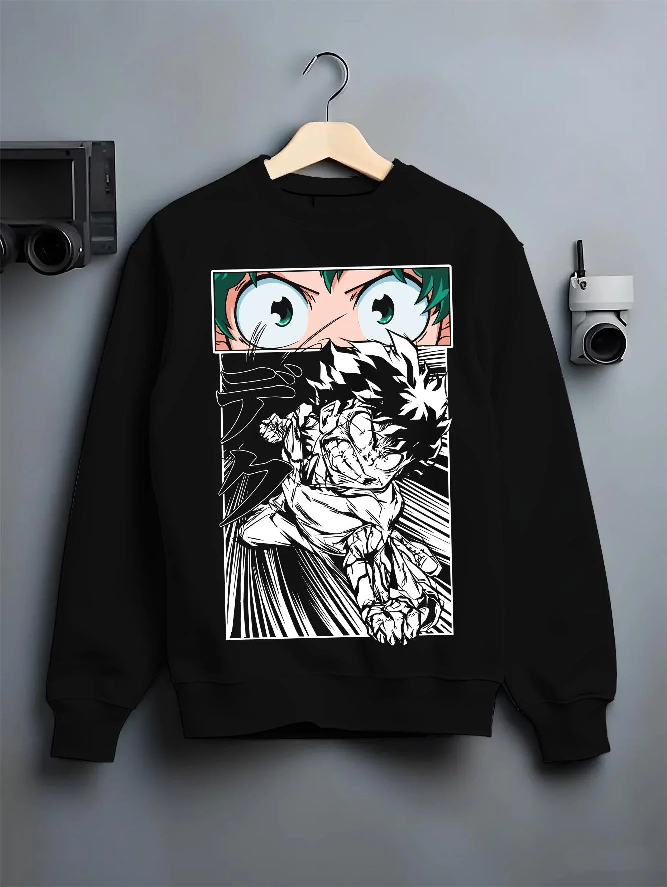 Black crewneck sweatshirt on hanger with Deku Hoodie My Hero Academia Dynamic Action Line Art graphic bold anime graphic.
