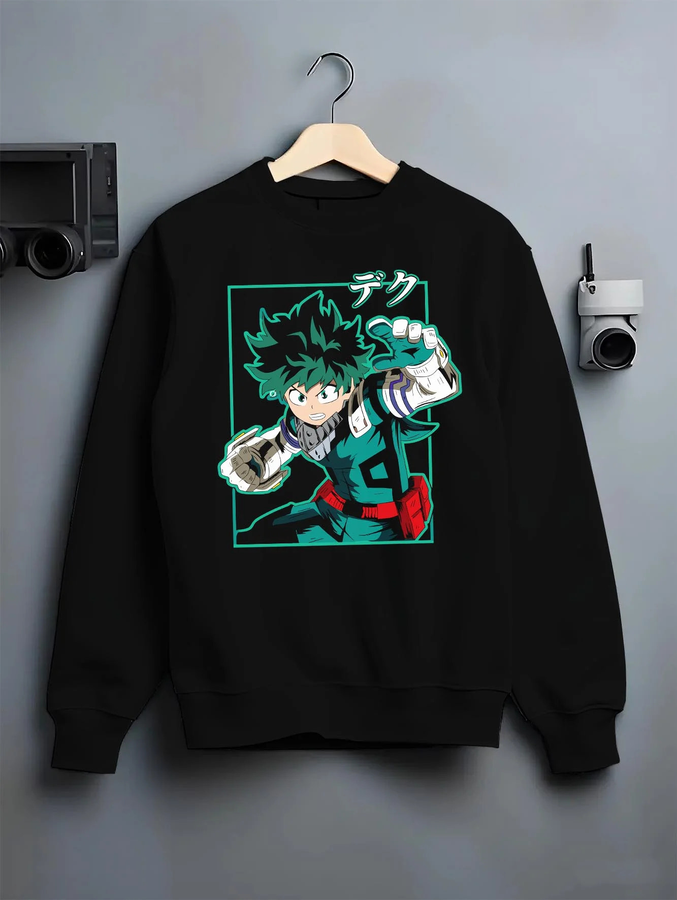 Black crewneck sweatshirt on hanger with Deku Hoodie My Hero Academia Hero Academy Retro Pose graphic premium wear.