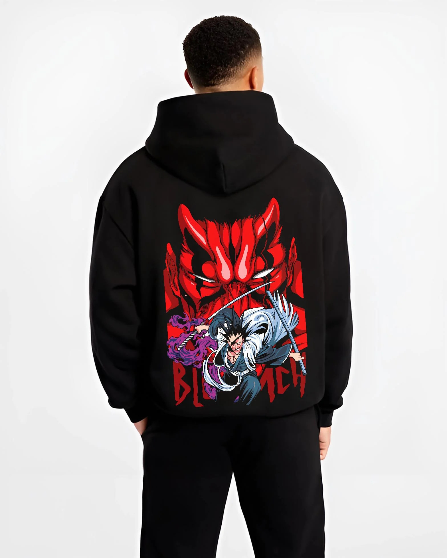 Black hoodie worn by male model, back view with Bleach Hoodie Ichigo and Hollow Mask Red Retro Scene graphic streetwear graphic.