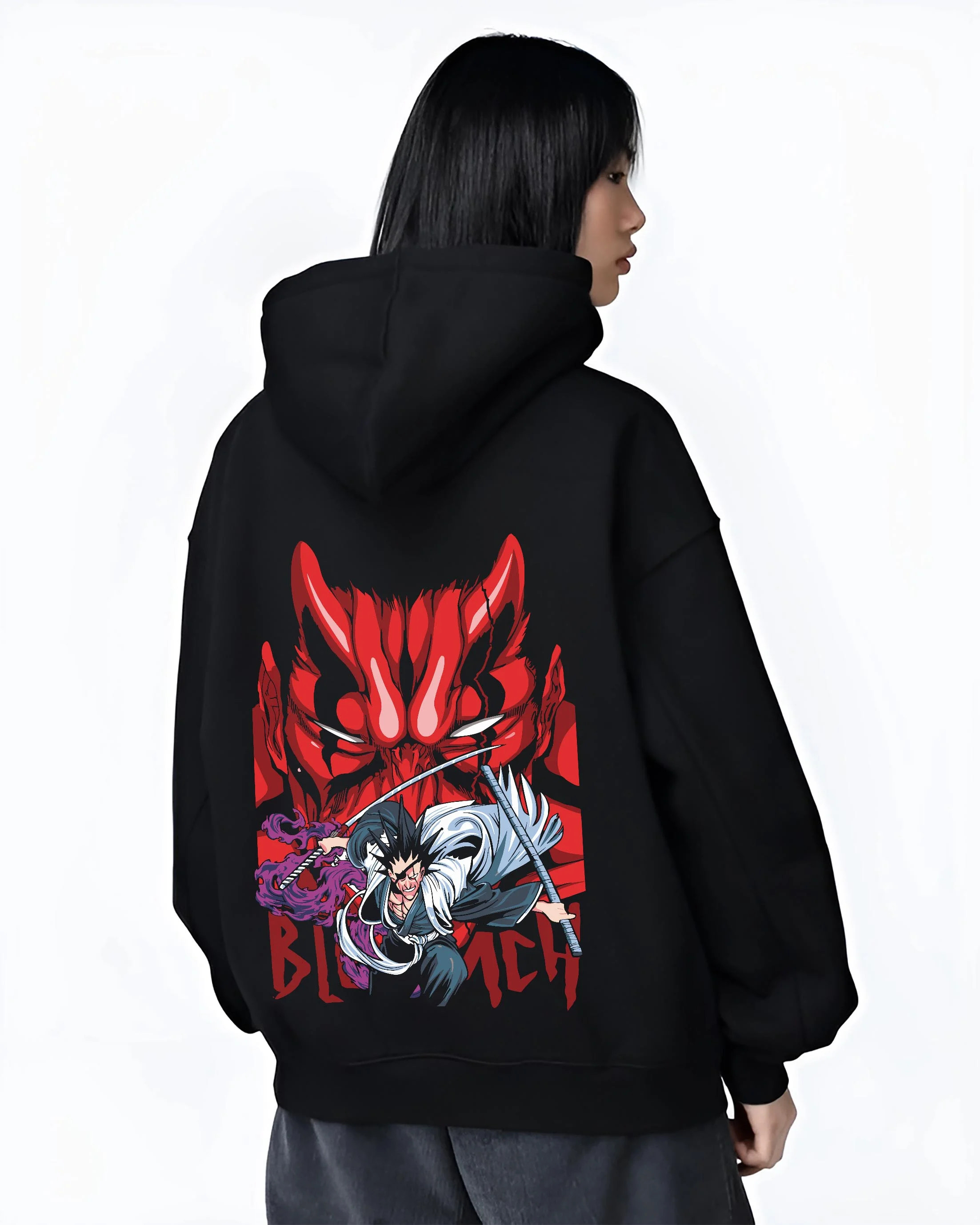Black hoodie worn by female model, back view with Bleach Hoodie Ichigo and Hollow Mask Red Retro Scene graphic streetwear graphic.