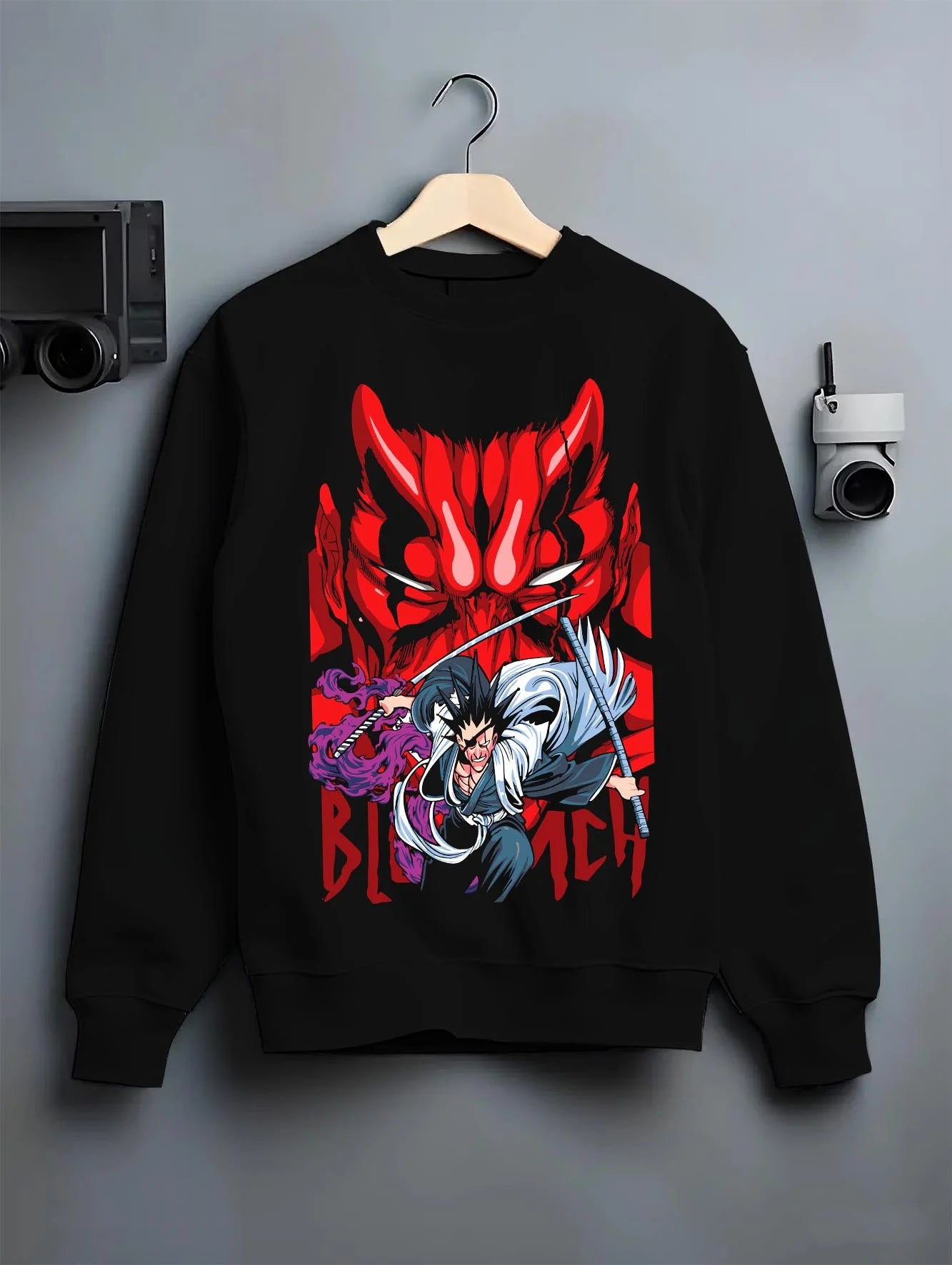Black crewneck sweatshirt on hanger with Bleach Hoodie Ichigo and Hollow Mask Red Retro Scene graphic streetwear graphic.