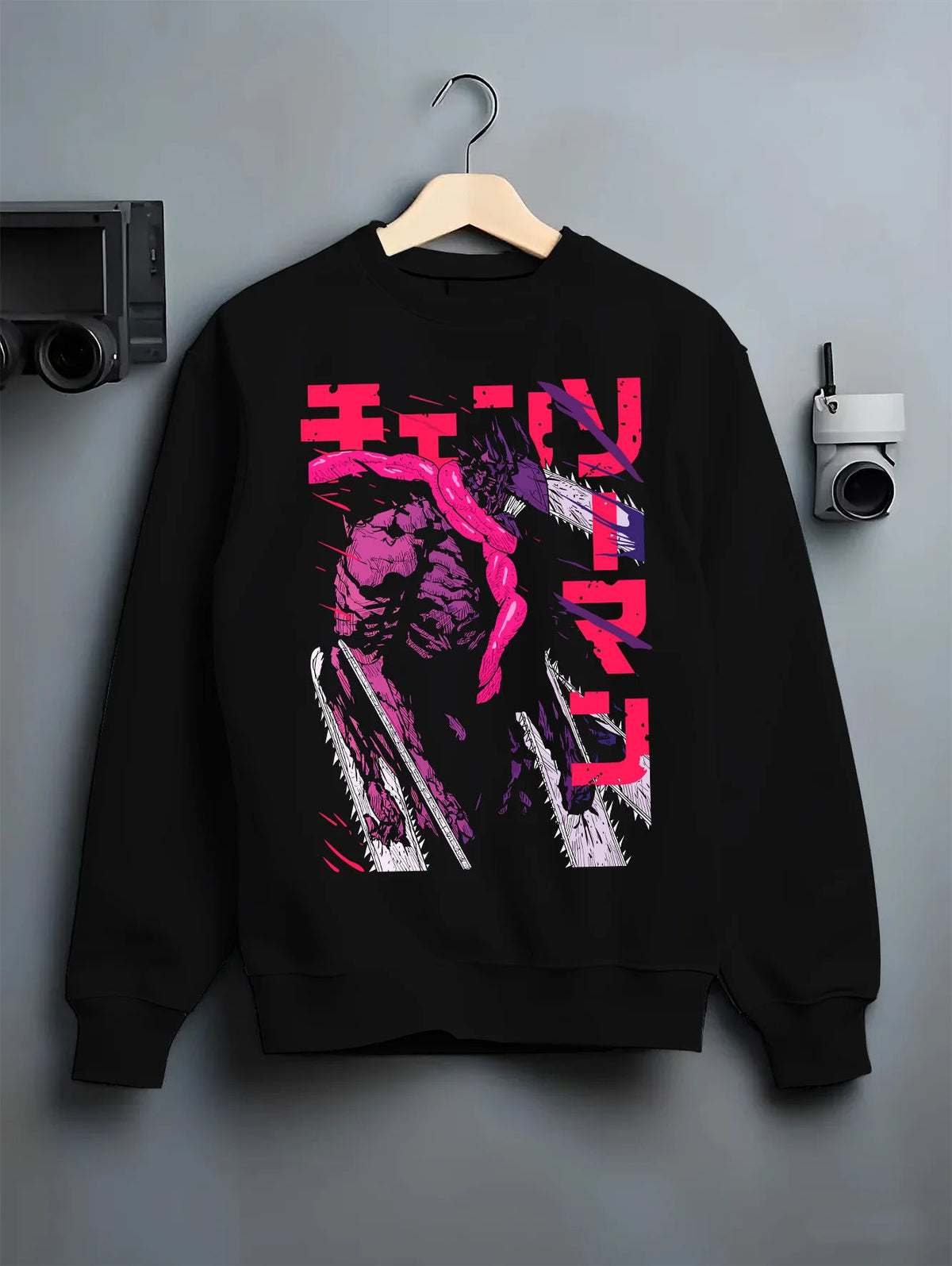 Black crewneck sweatshirt on hanger showing Chainsaw Devil / Denji from Chainsaw Man: purple transformed figure