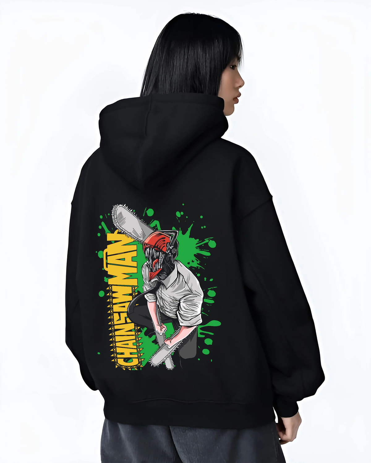 Black hoodie female model back view showing Denji transformed from Chainsaw Man: chainsaw head and shirt, green background