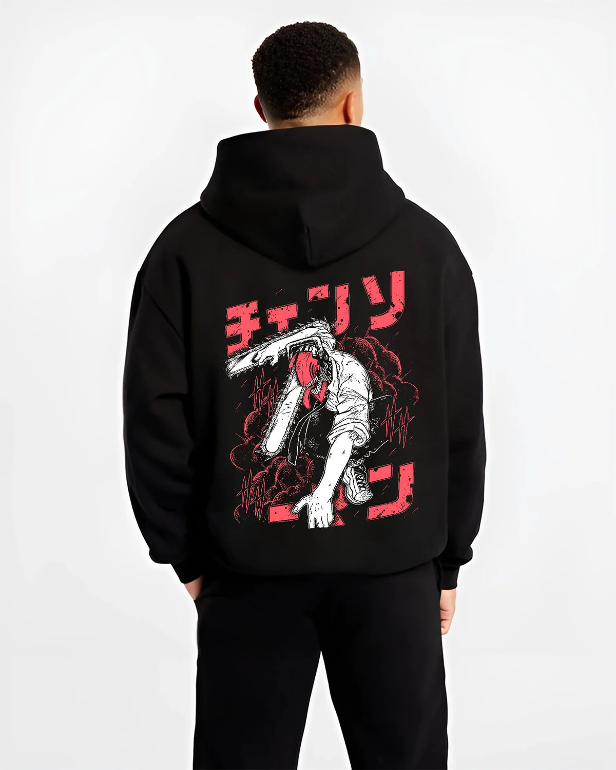 Black hoodie model back view showing Denji transformed from Chainsaw Man: black-white chainsaw head, red lettering