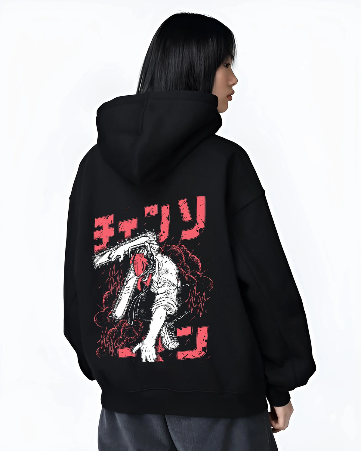 Black hoodie female model back view showing Denji transformed from Chainsaw Man: black-white chainsaw head, red lettering