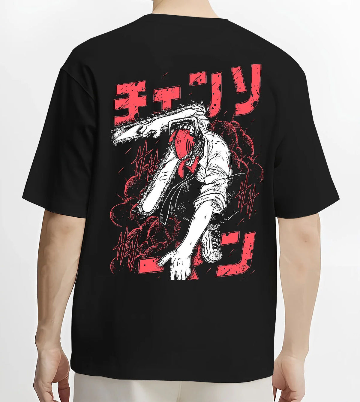 Black T-shirt model back view showing Denji transformed from Chainsaw Man: black-white chainsaw head, red lettering