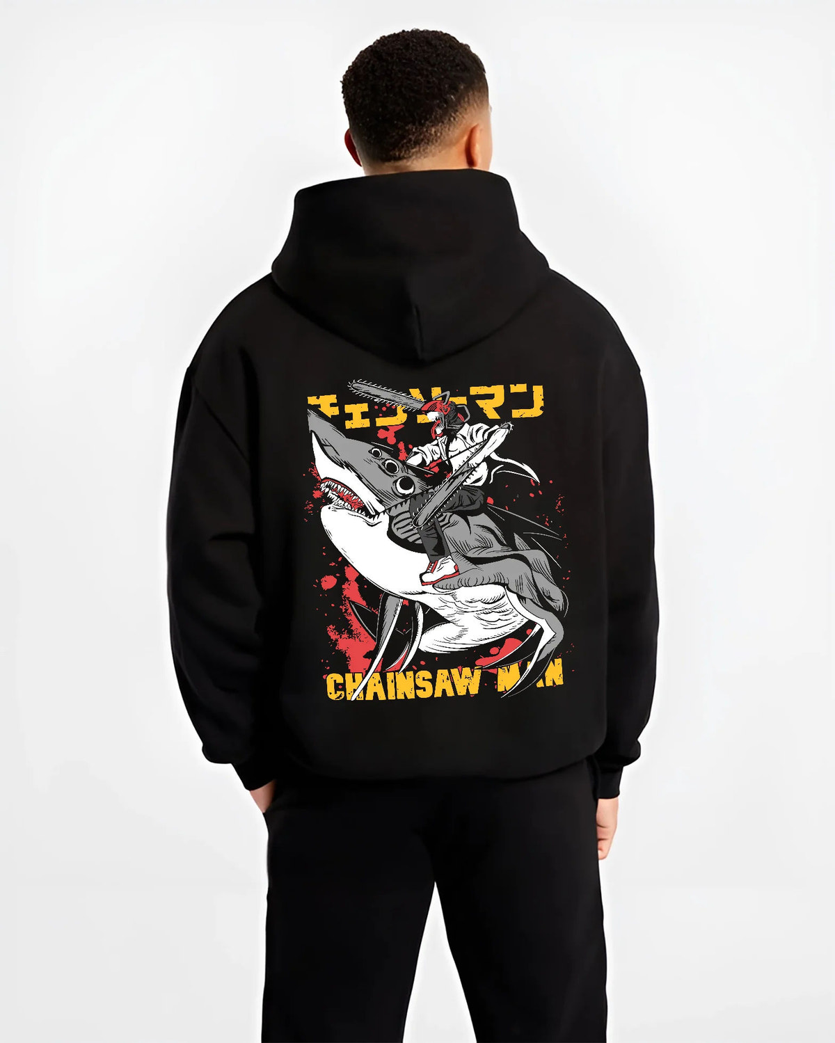 Black hoodie model back view showing Chainsaw Devil / Denji from Chainsaw Man: graphic chainsaw-mouth attack