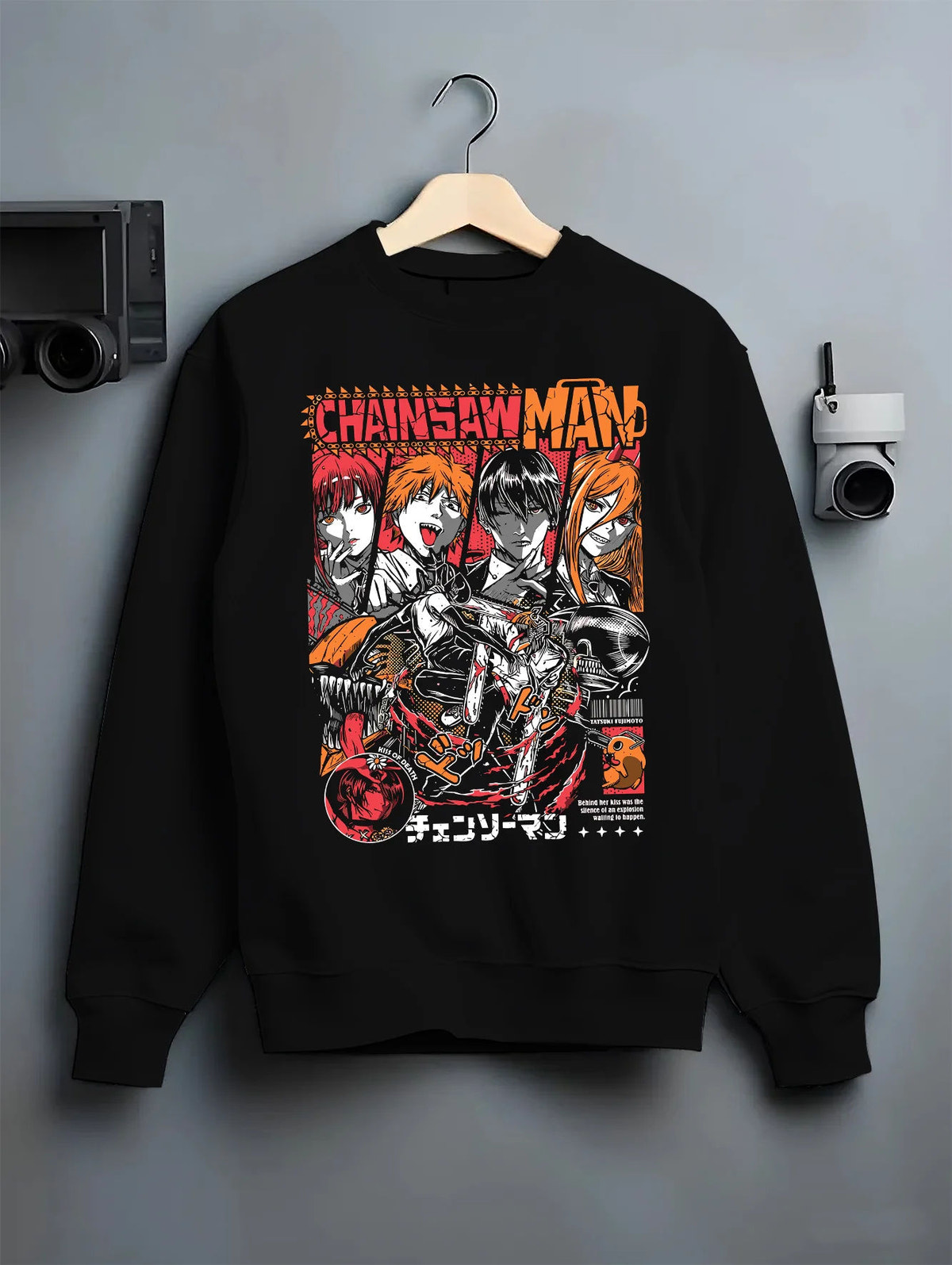 Black crewneck sweatshirt on hanger showing Chainsaw Man cast: Denji, Power, Makima and others