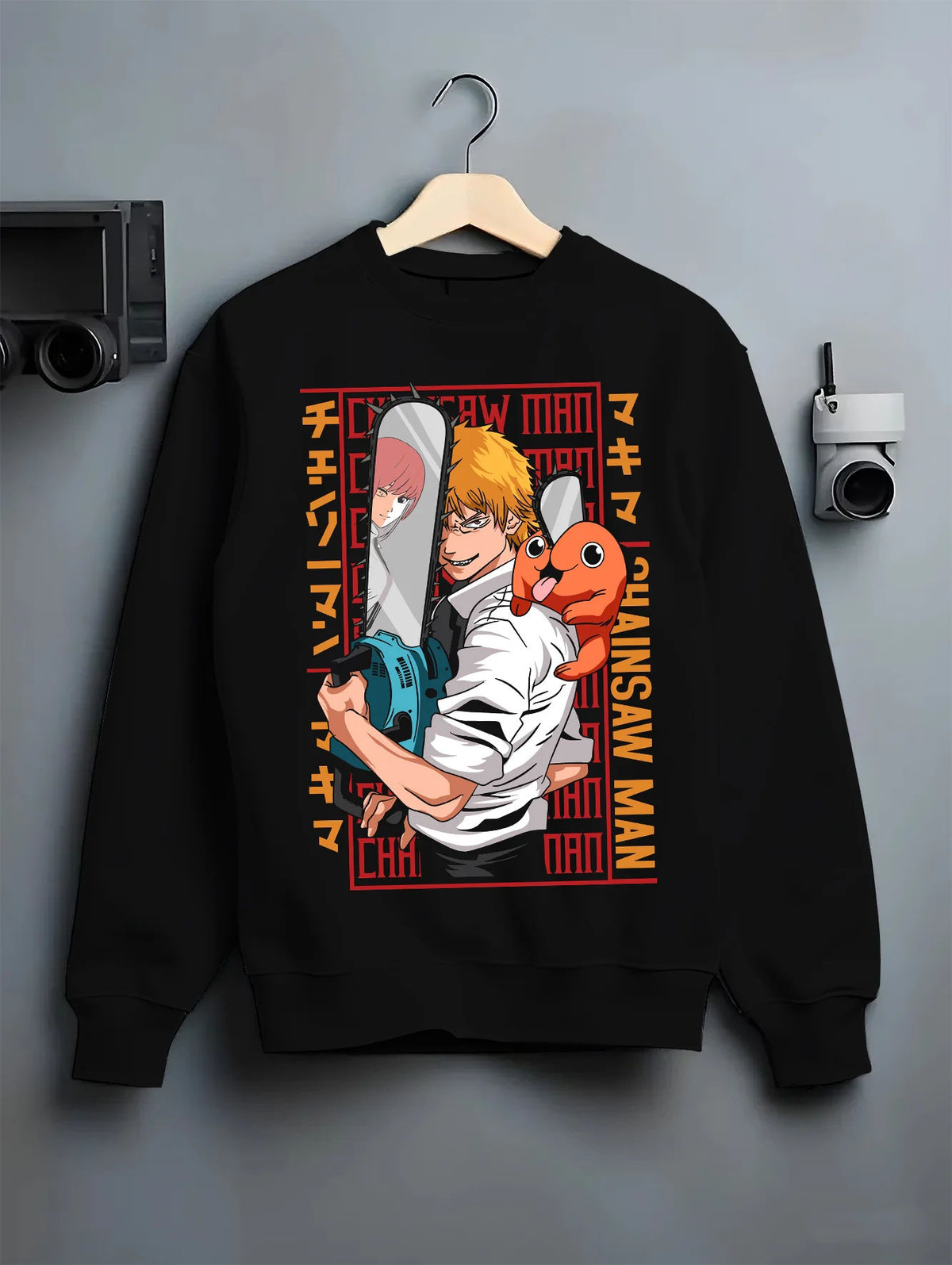 Black crewneck sweatshirt on hanger with Denji with Pochita, chainsaw and Makima-inspired backdrop from Chainsaw Man