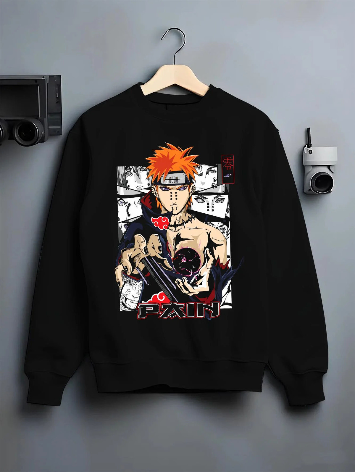 Black crewneck sweatshirt on hanger featuring Pain Naruto Akatsuki Rinnegan Six Paths artwork.
