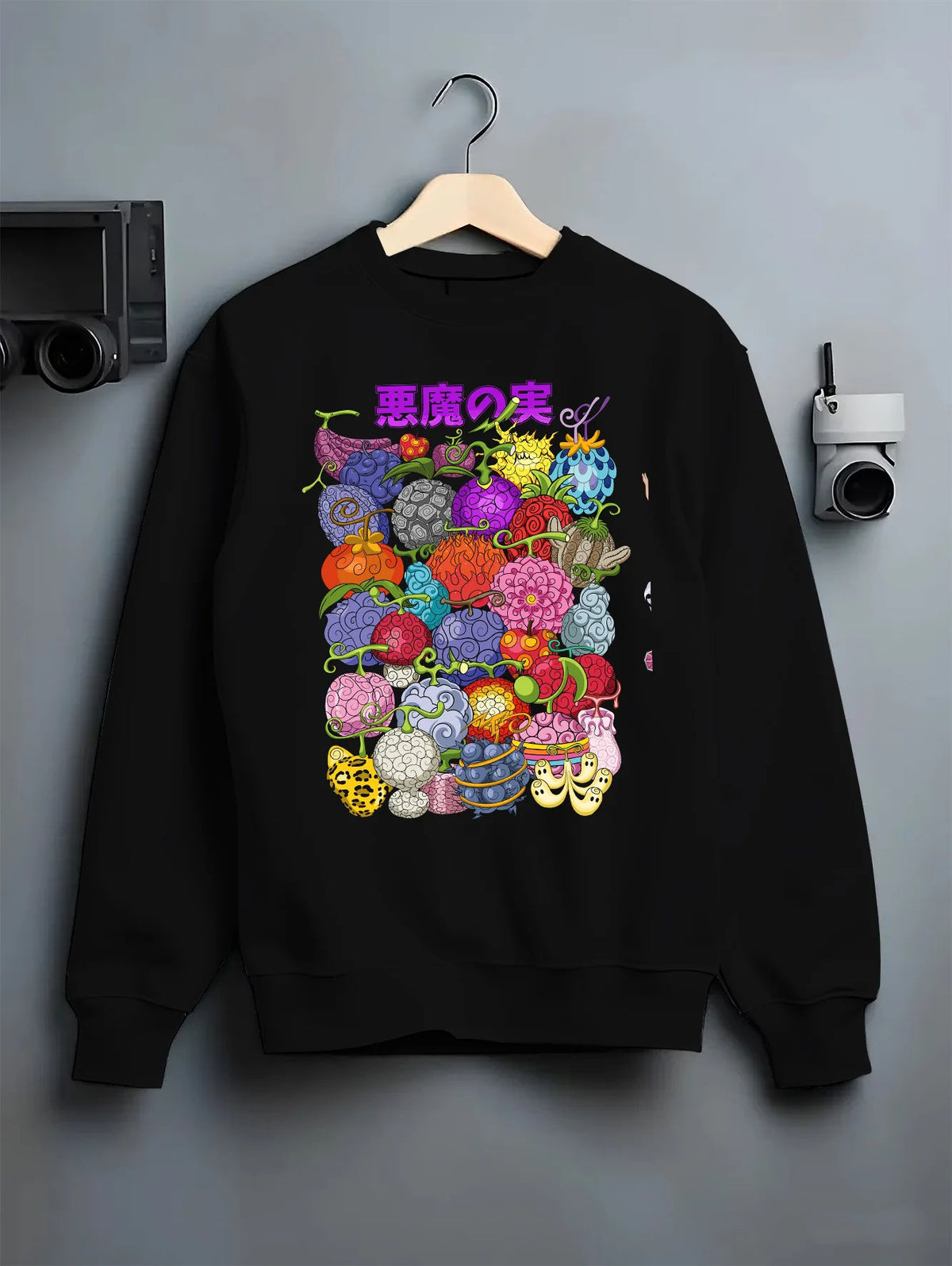 Black crewneck sweatshirt on hanger showing Devil Fruits from One Piece: various designs