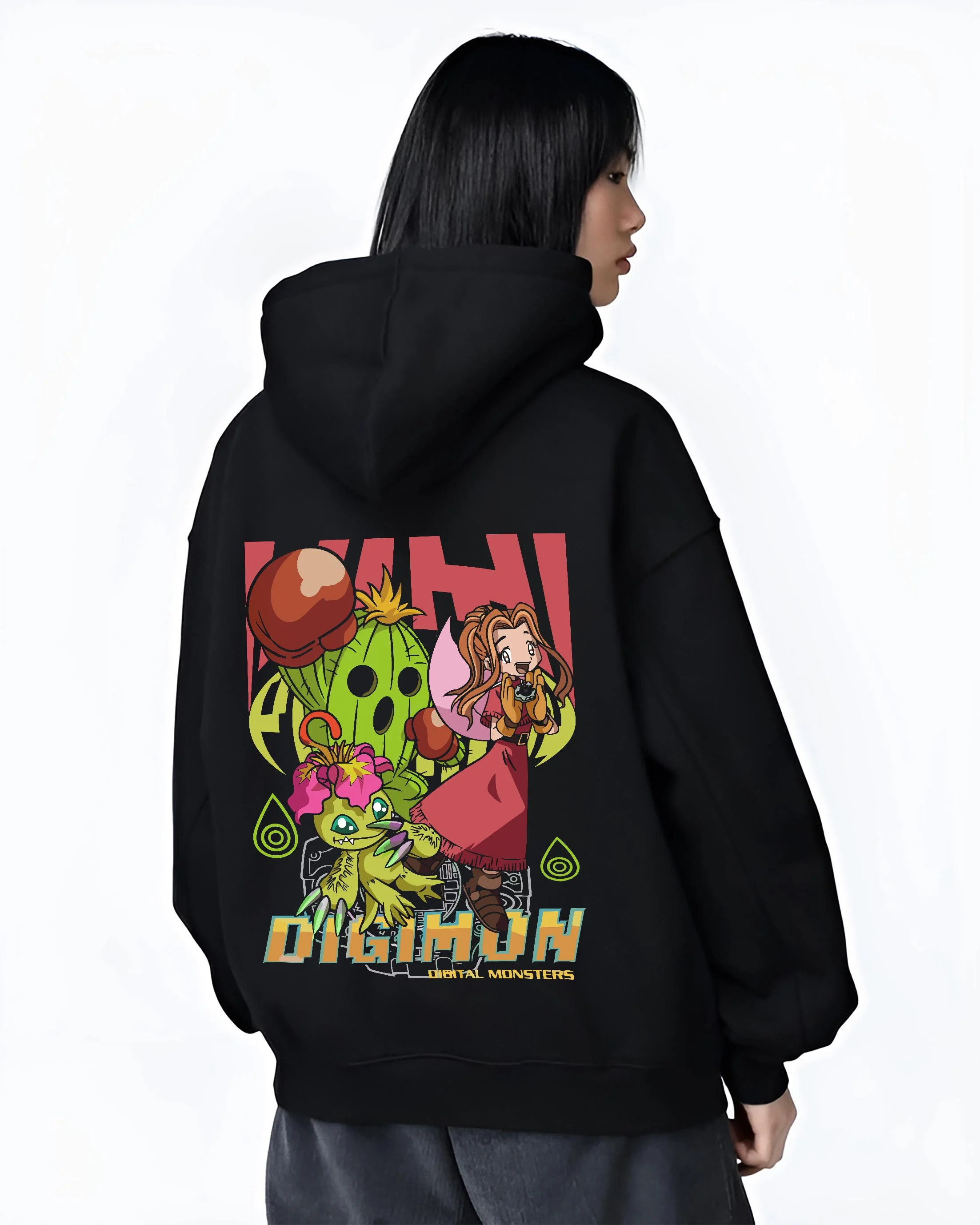 Black hoodie worn by female model, back view with Digimon Hoodie Mimi with Palmon Retro Partner Print graphic premium wear.