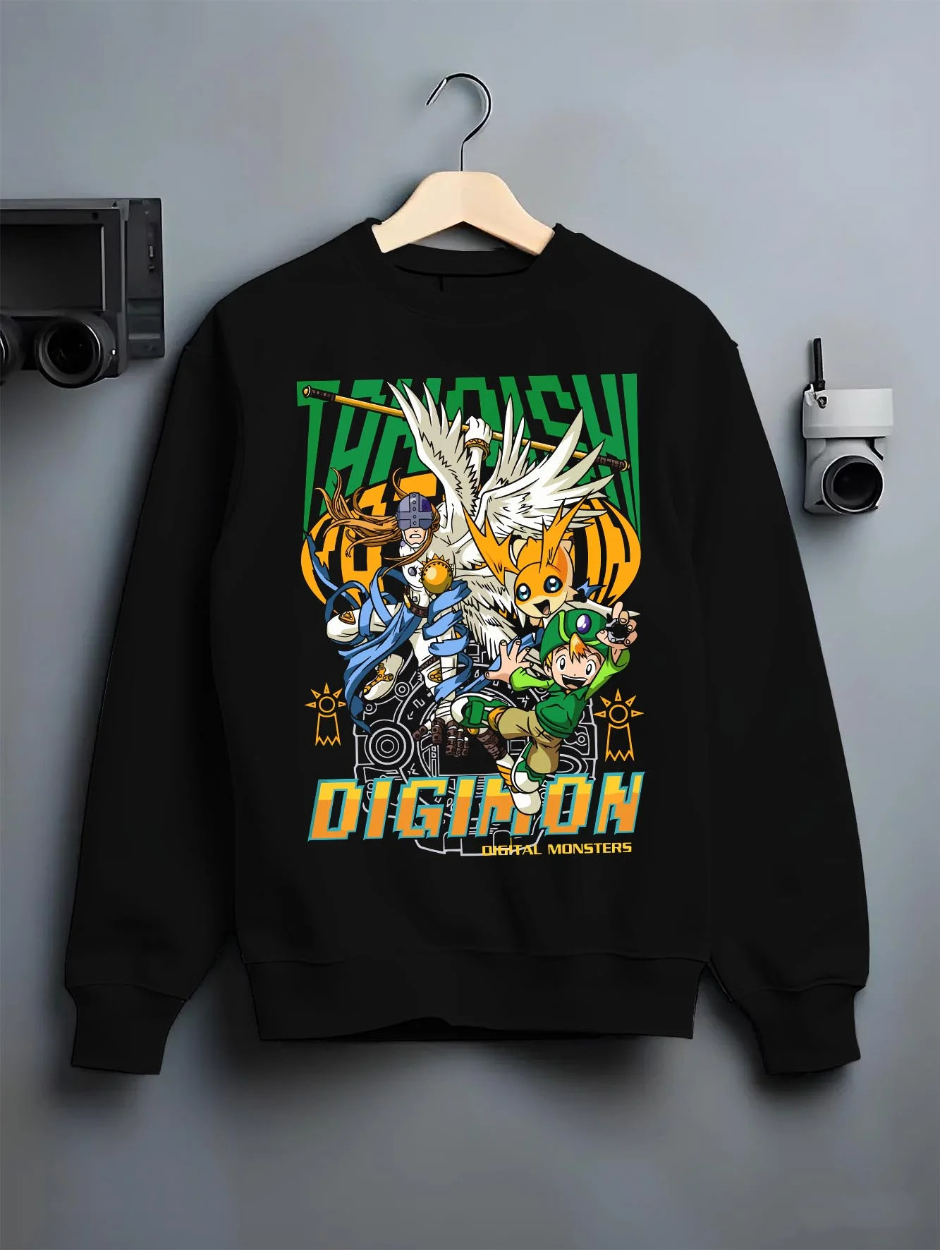 Black crewneck sweatshirt on hanger with Digimon Hoodie Patamon Evolution Retro Anime Poster graphic streetwear graphic.