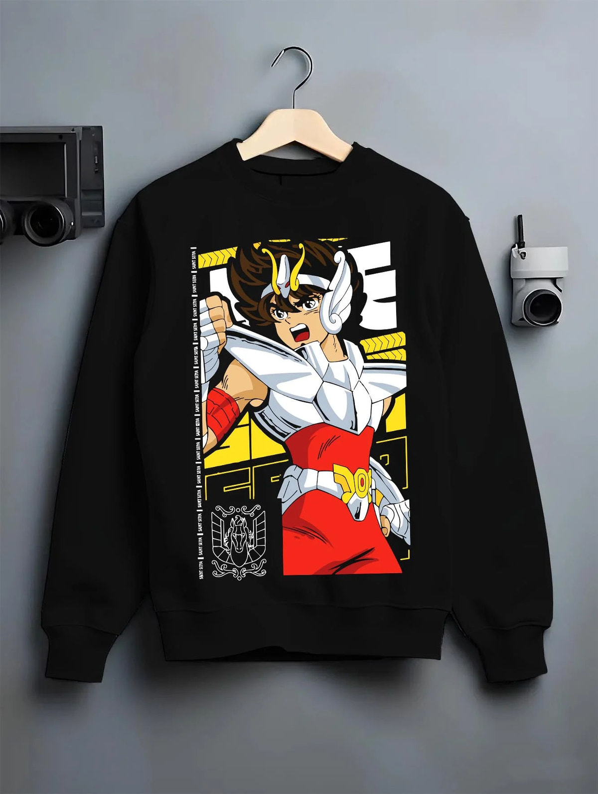 Black crewneck sweatshirt on hanger featuring Pegasus Seiya Saint Seiya divine armor artwork.