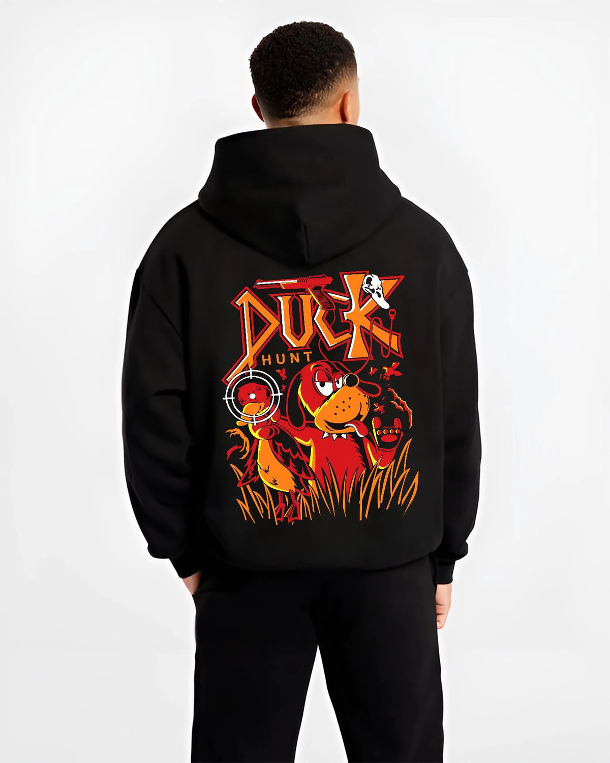 Black hoodie worn by male model from the back featuring Duck Hunt retro gaming dog artwork.