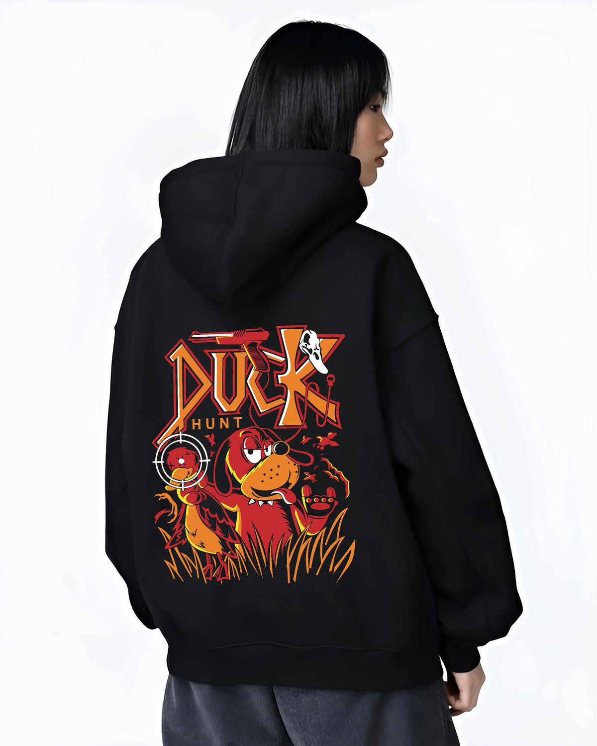Black hoodie worn by female model from the back featuring Duck Hunt retro gaming dog artwork.