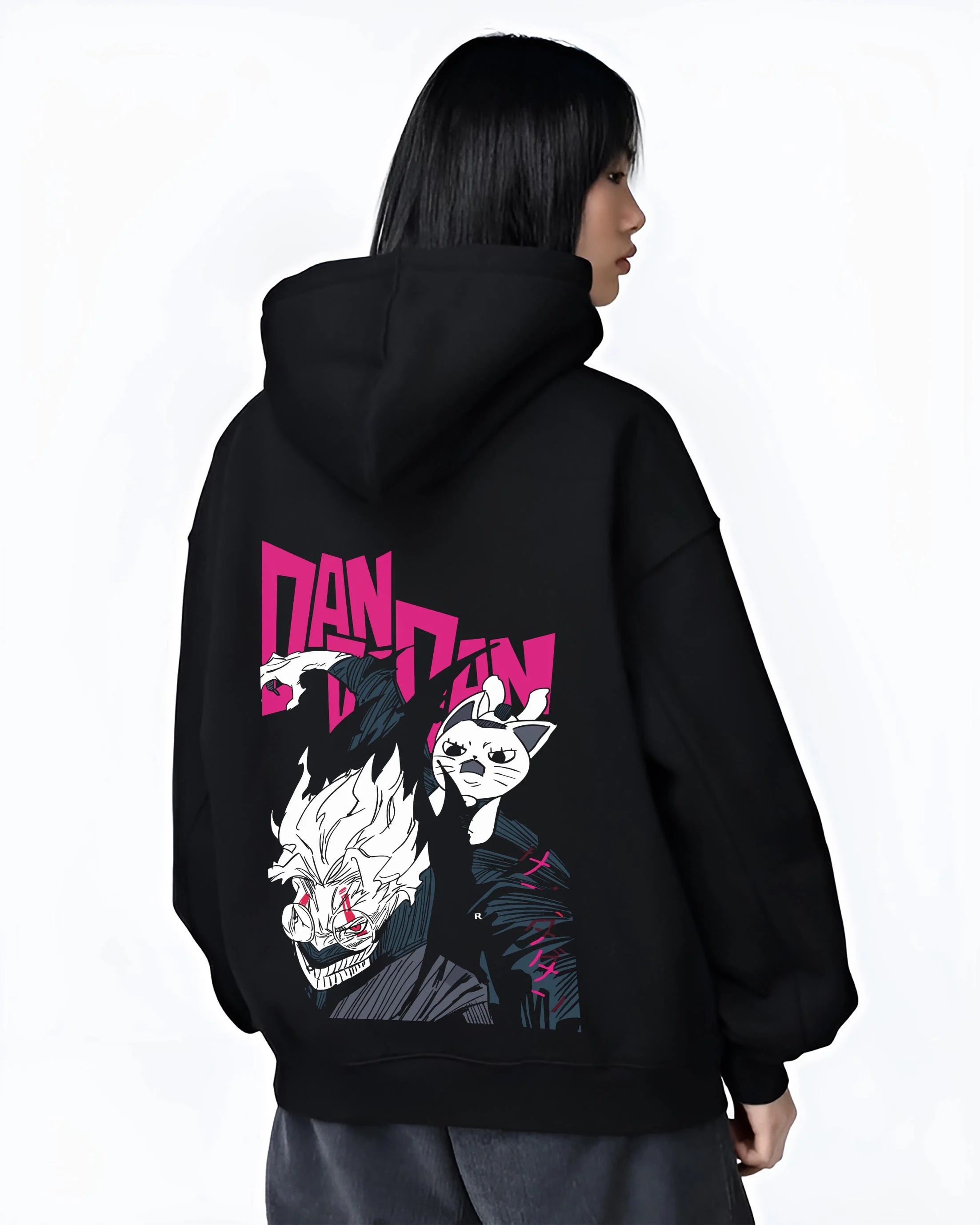 Black hoodie worn by female model, back view with Dandadan Hoodie Hero Transformation Retro Anime Art graphic premium wear.