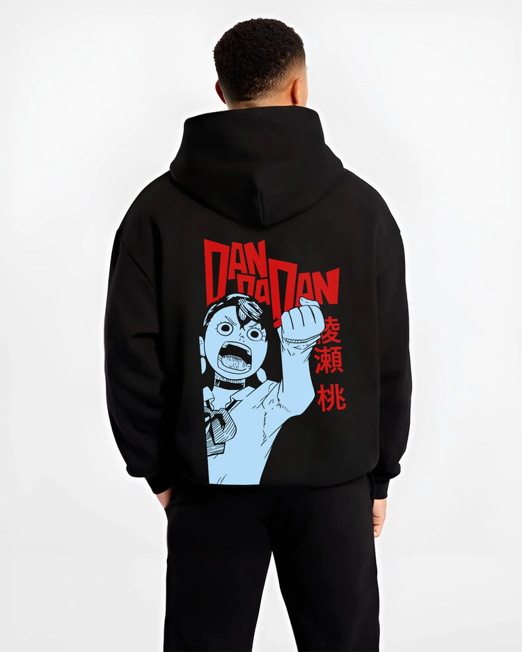Black hoodie worn by male model, back view with Dandadan Hoodie Momo Ayase Paranormal Retro Poster graphic premium wear.