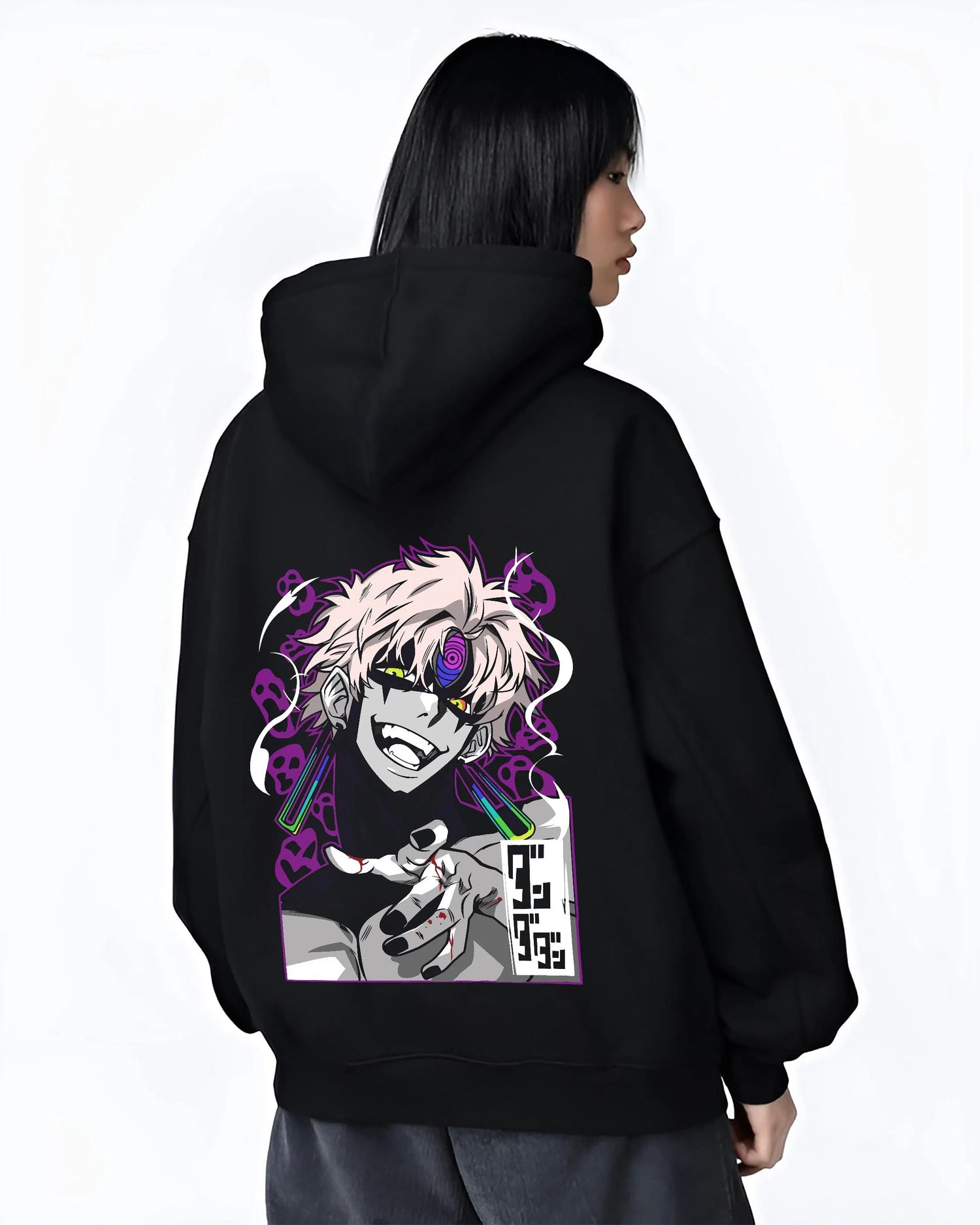 Black hoodie worn by female model, back view with Dandadan Hoodie Spirit Paranormal Duo Retro Battle graphic streetwear graphic.