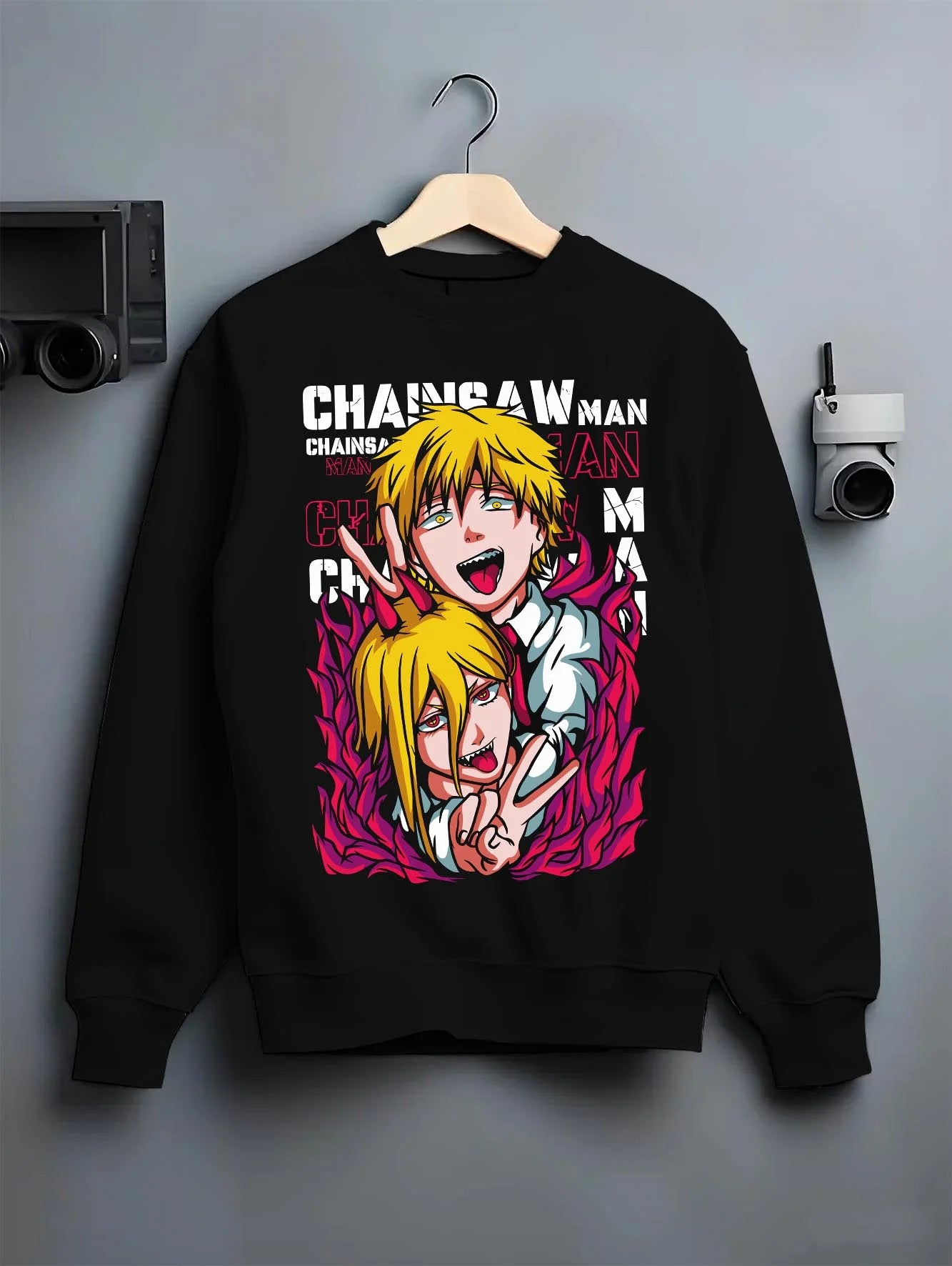 Black crewneck sweatshirt on hanger with Chainsaw Man Hoodie Denji Power Anime Retro Poster graphic streetwear graphic.