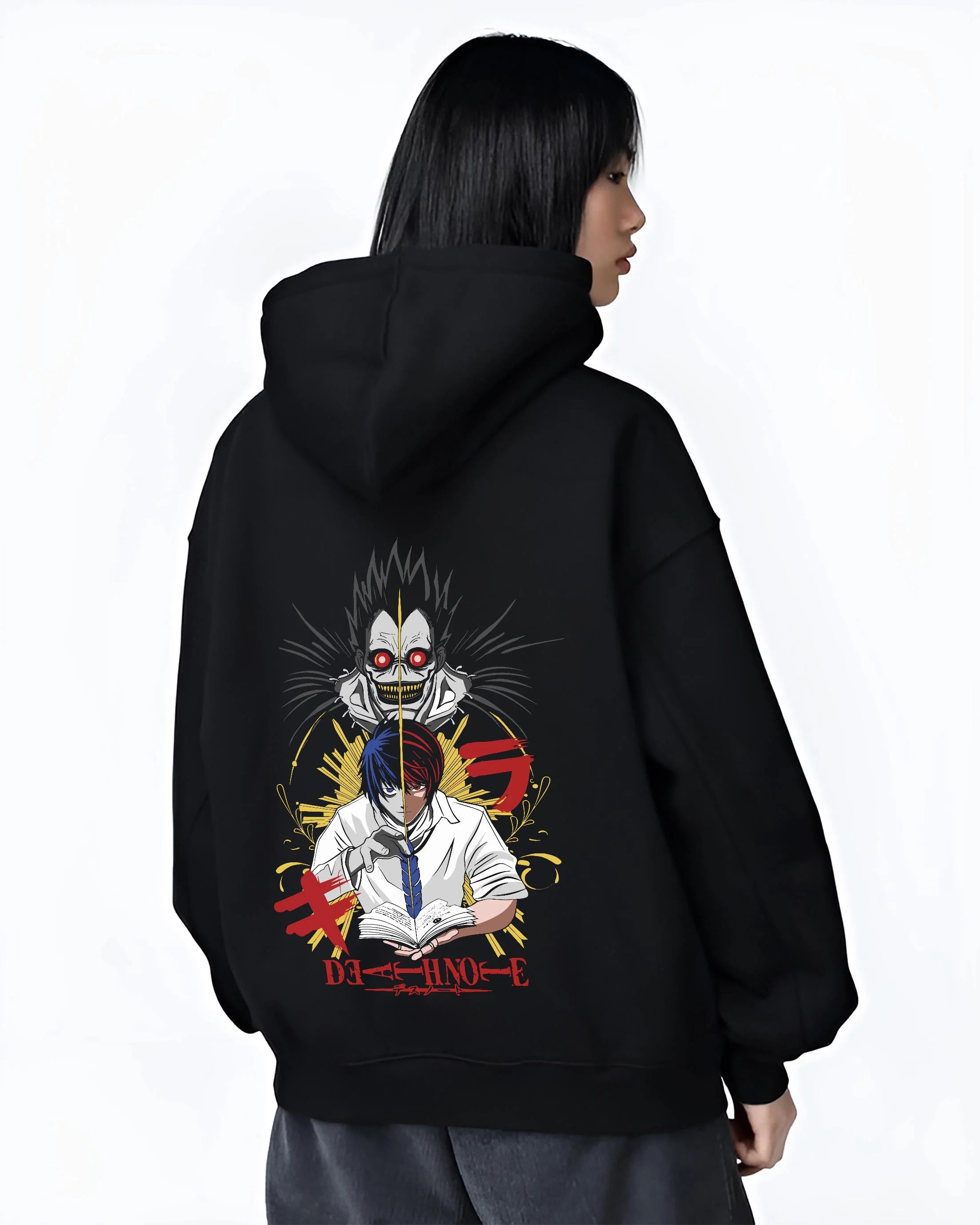 Black hoodie worn by female model, back view with Ryuk Hoodie Death Note Retro Anime Shinigami Poster graphic streetwear graphic.
