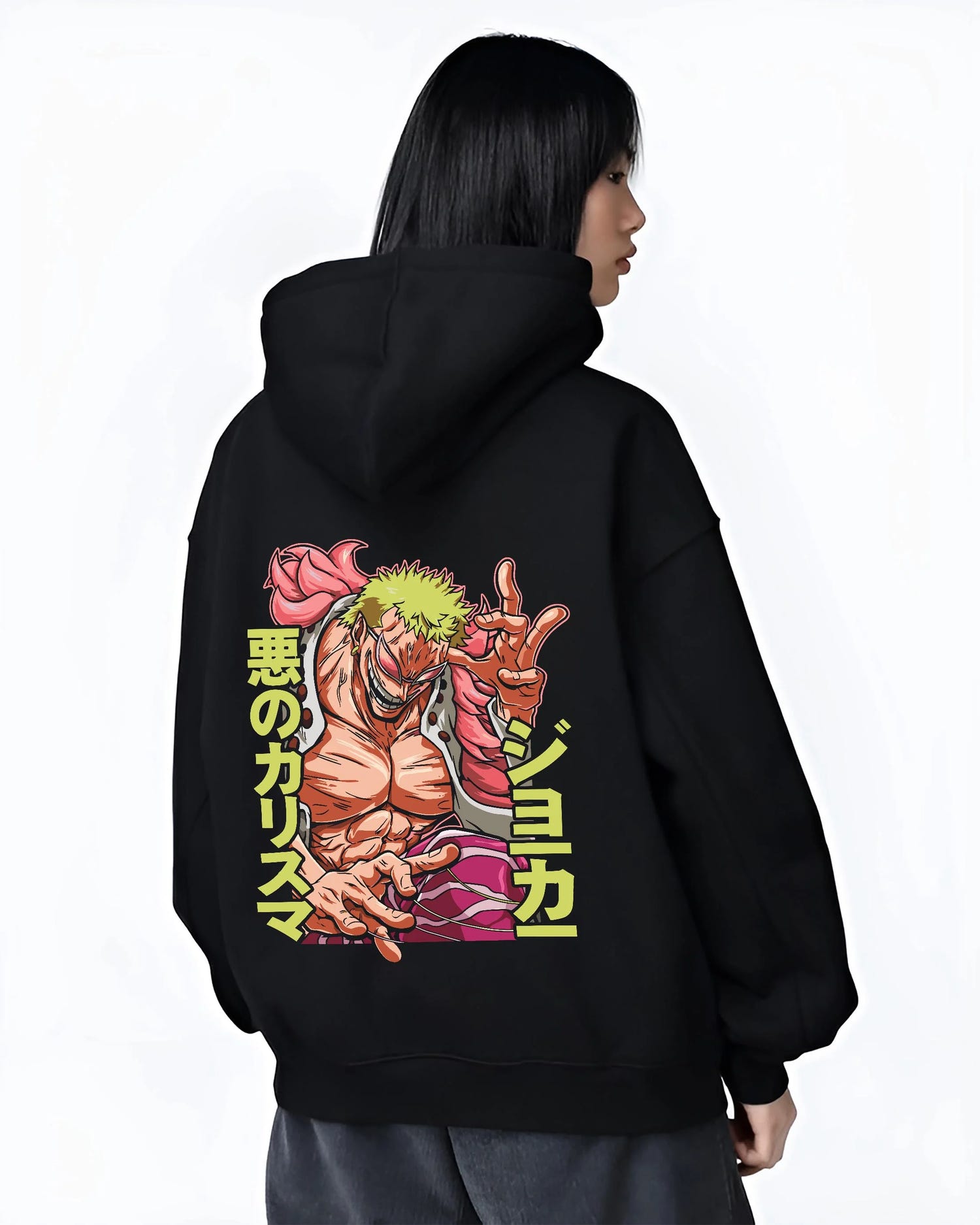 Black hoodie worn by female model, back view with Doflamingo Hoodie One Piece Retro Villain Pose Art graphic streetwear graphic.
