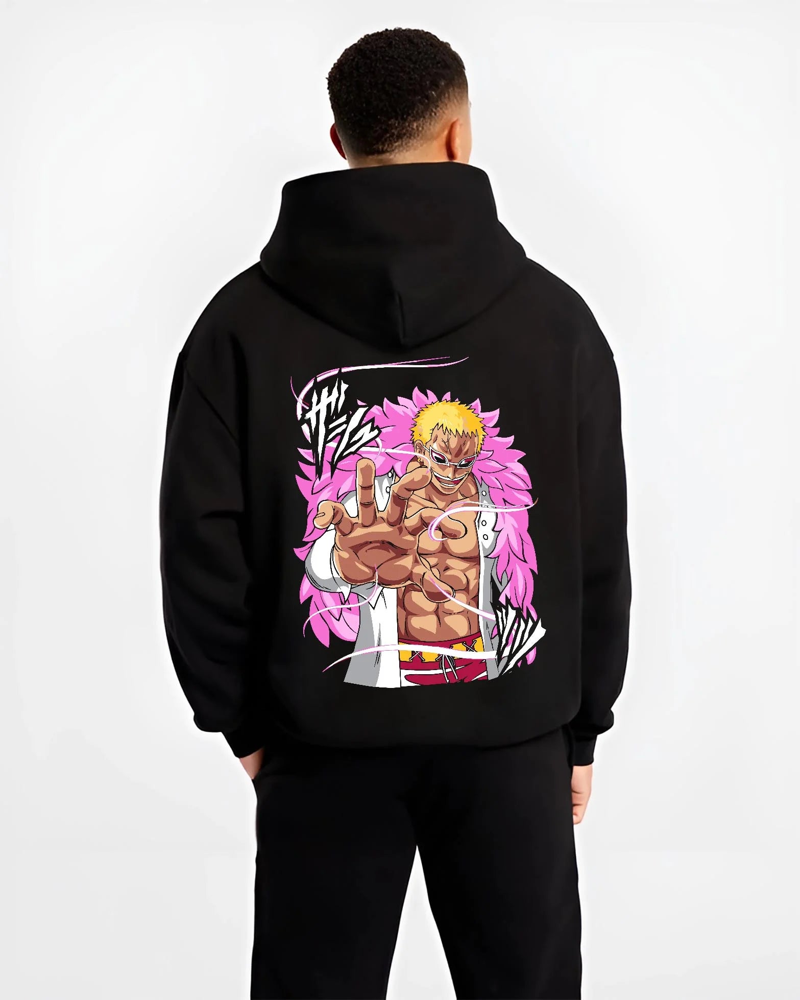 Black hoodie worn by male model, back view with Doflamingo Hoodie One Piece Villain Charisma Poster graphic streetwear graphic.