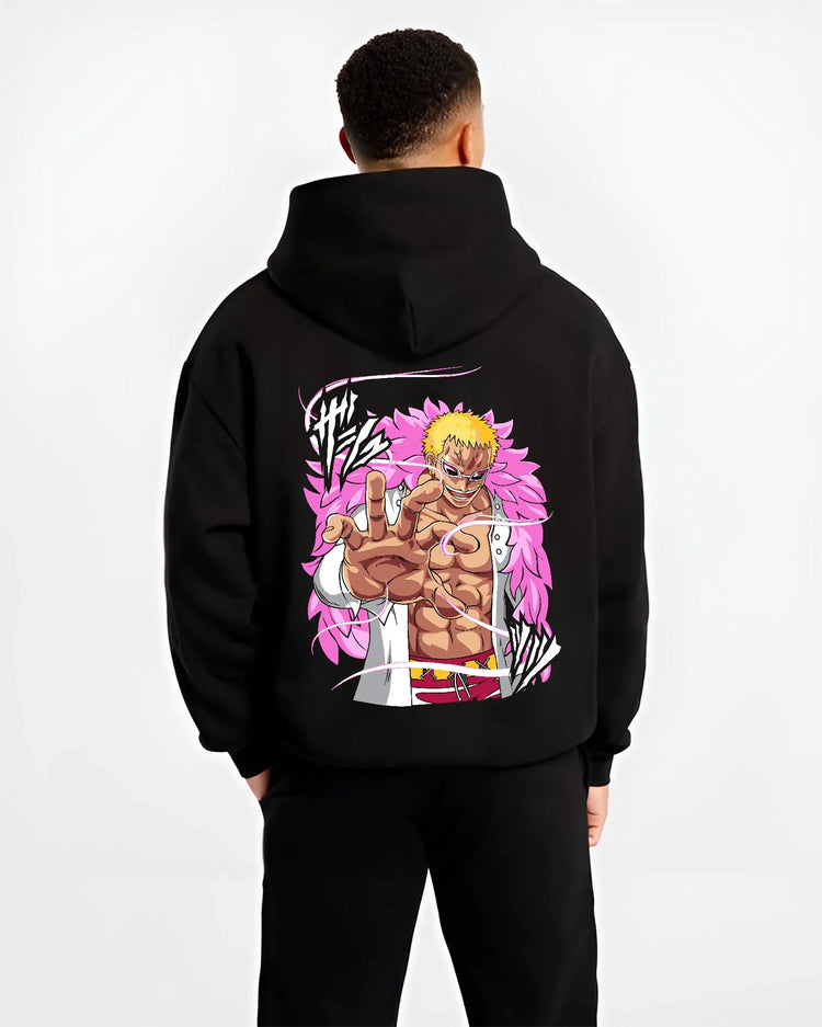 Black hoodie worn by male model, back view with Doflamingo Hoodie One Piece Villain Charisma Poster graphic streetwear graphic.