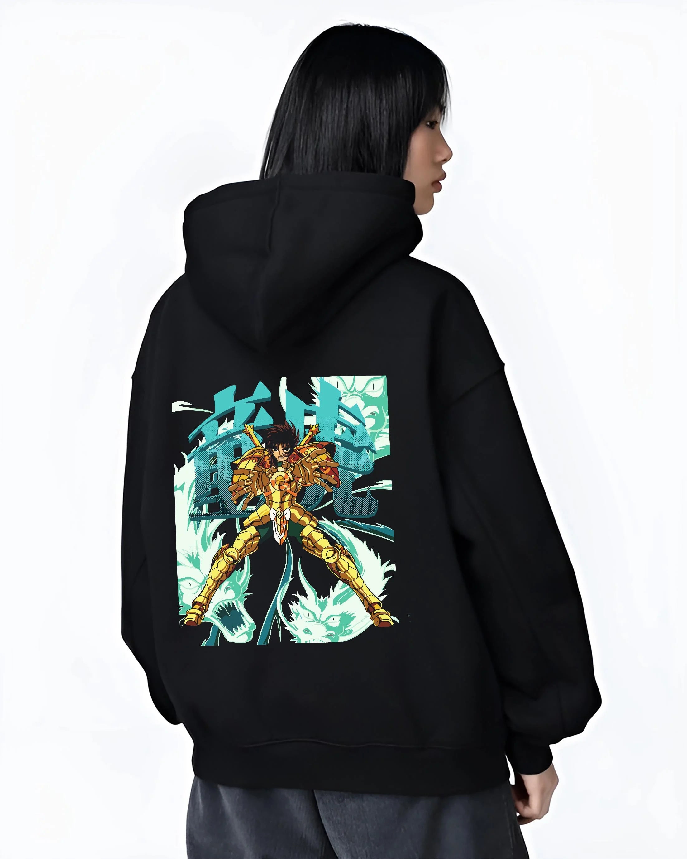 Black hoodie worn by female model, back view with Shiryu Hoodie Saint Seiya Dragon Gold Cloth Retro graphic streetwear graphic.