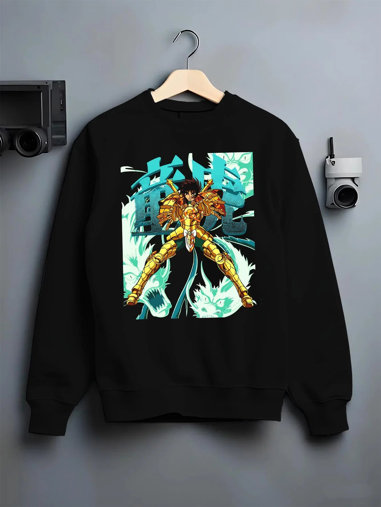 Black crewneck sweatshirt on hanger with Shiryu Hoodie Saint Seiya Dragon Gold Cloth Retro graphic streetwear graphic.