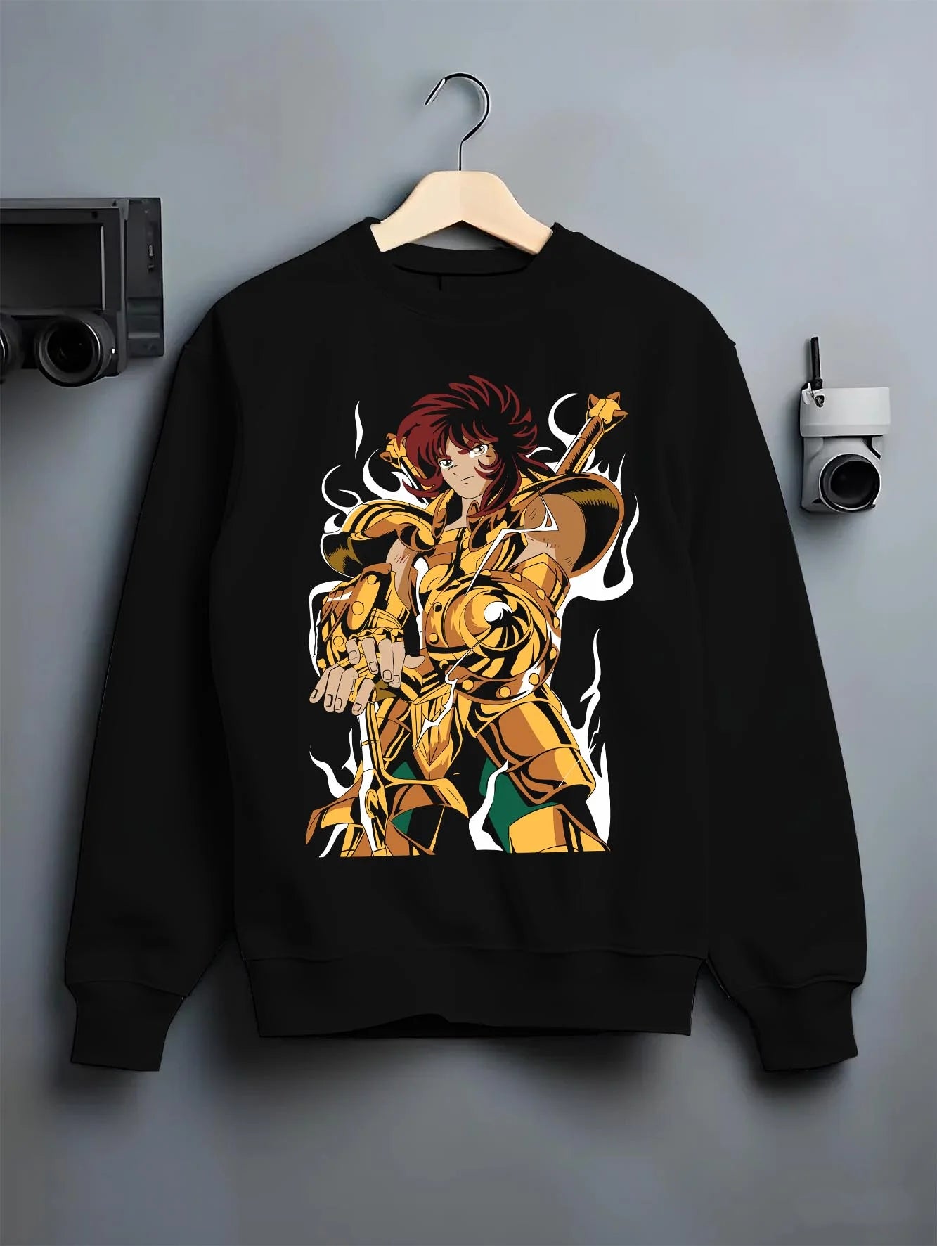 Black crewneck sweatshirt on hanger with Aiolia Hoodie Saint Seiya Gold Saint Leo Armour graphic premium wear.