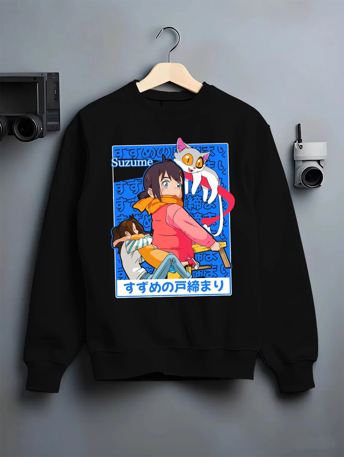Black crewneck sweatshirt on hanger featuring Suzume sky door fantasy artwork.
