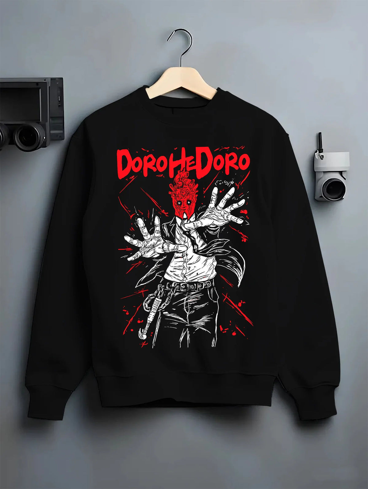 Black crewneck sweatshirt on hanger showing Dorohedoro: Caiman/character red hand illustration