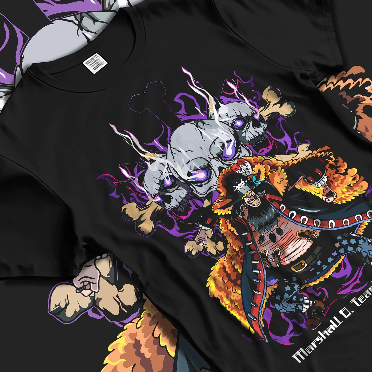 Black T-shirt laid flat with natural folds featuring Marshall D. Teach One Piece dark fruit artwork.