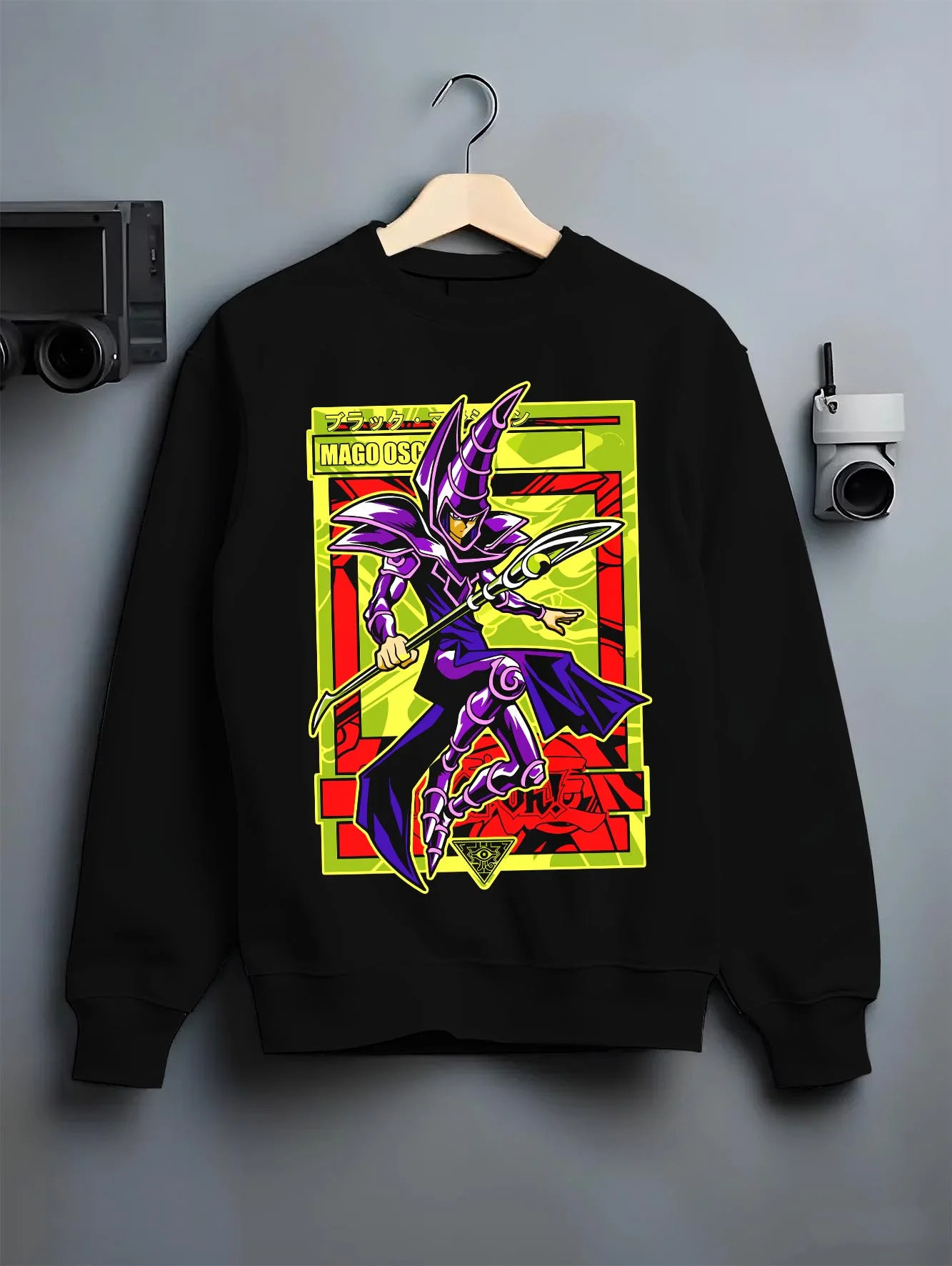 Black crewneck sweatshirt on hanger with Yu-Gi-Oh Dark Magician Hoodie Classic Spell Jumper graphic bold anime graphic.