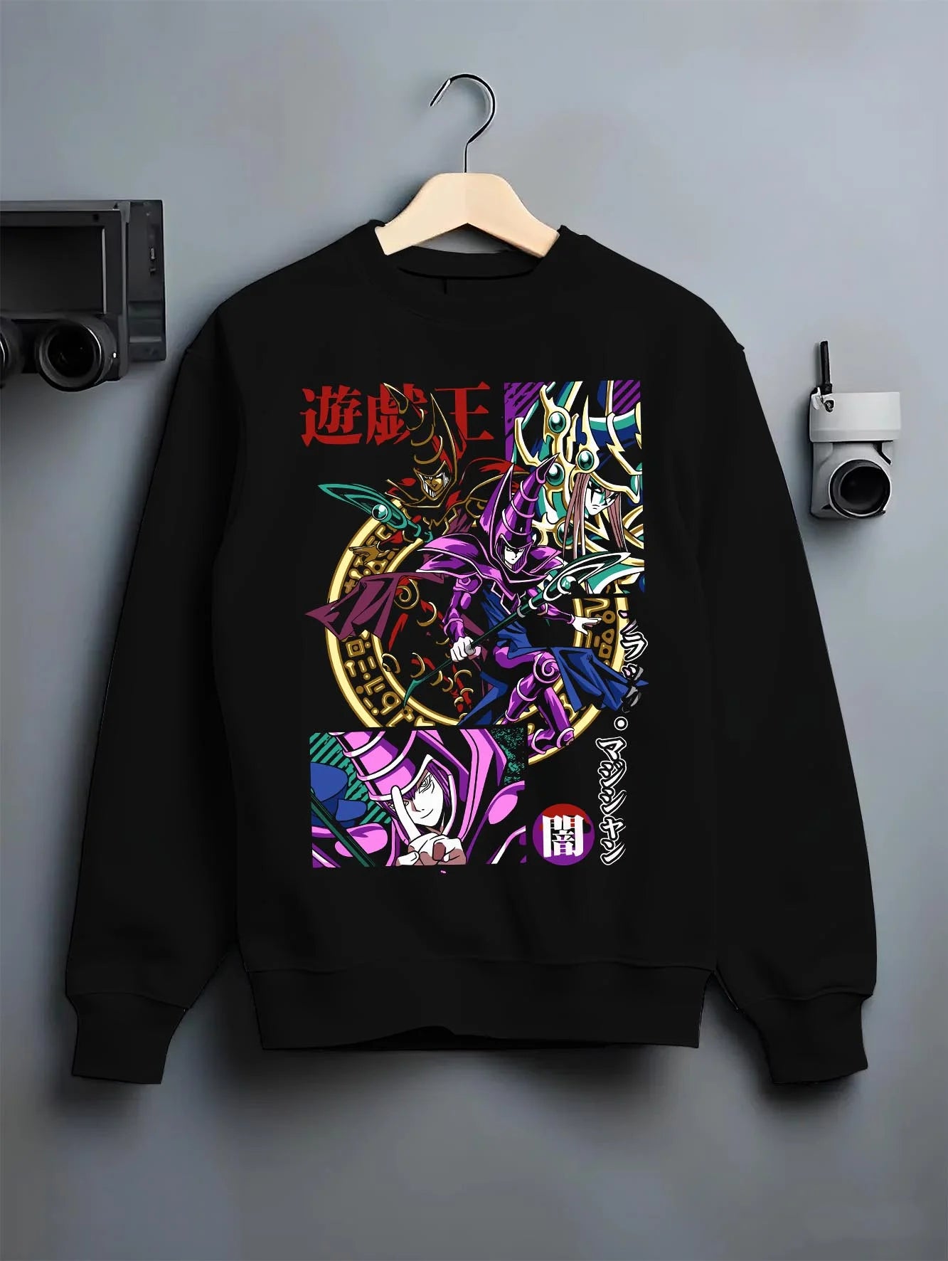 Black crewneck sweatshirt on hanger with Yu-Gi-Oh Dark Magician Hoodie Duel Monsters Jumper graphic bold anime graphic.