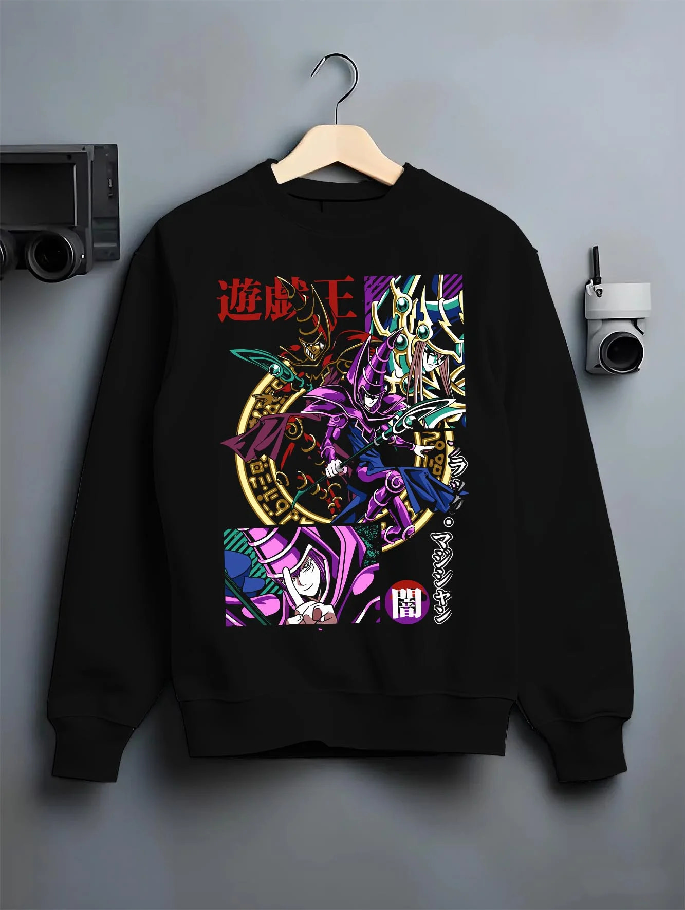 Black crewneck sweatshirt on hanger with Yu-Gi-Oh Dark Magician Hoodie Duel Monsters Jumper graphic bold anime graphic.