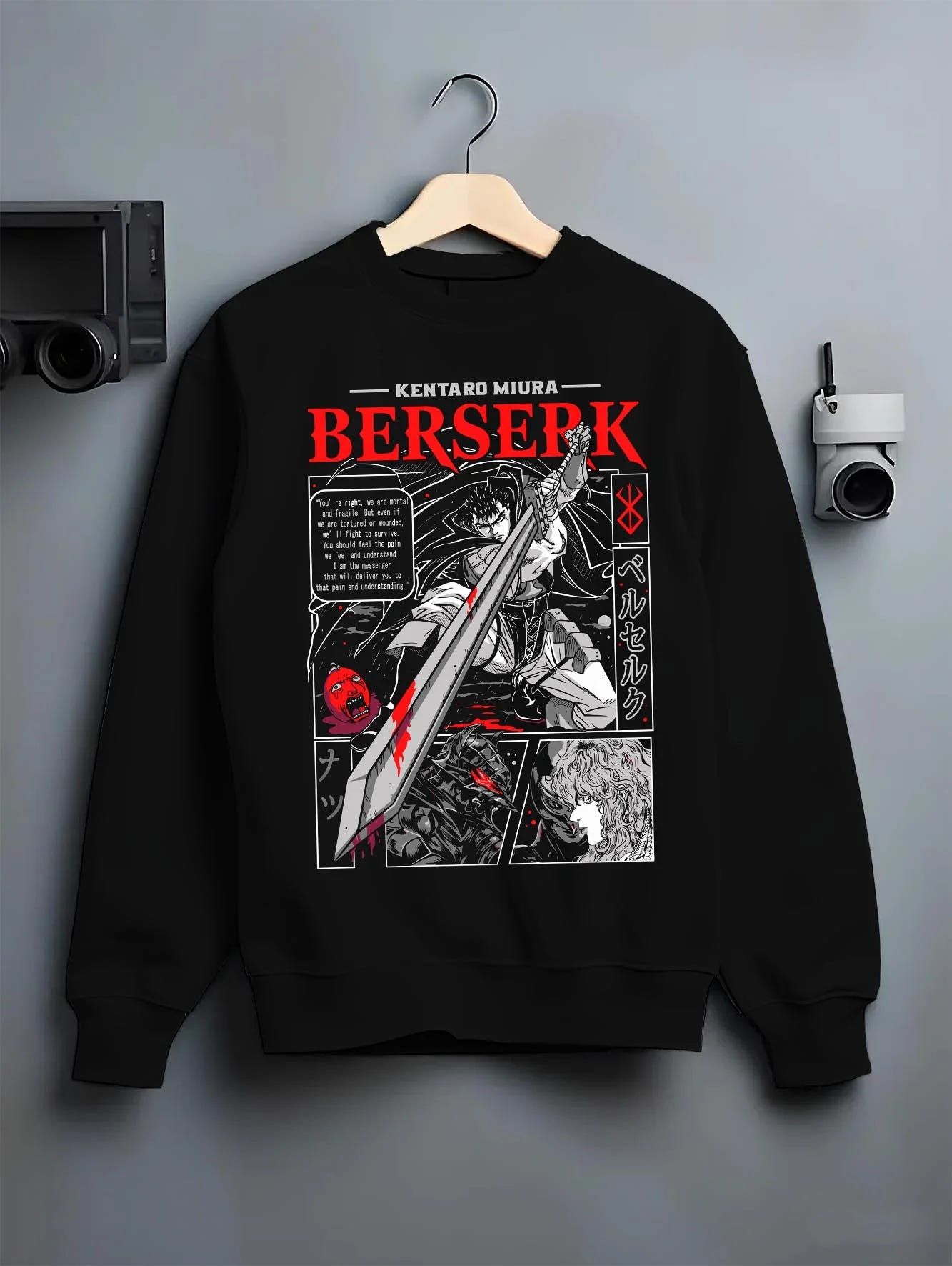 Black crewneck sweatshirt on hanger with Berserk Hoodie Guts Retro Dark Fantasy Warrior Art graphic Guts themed artwork.