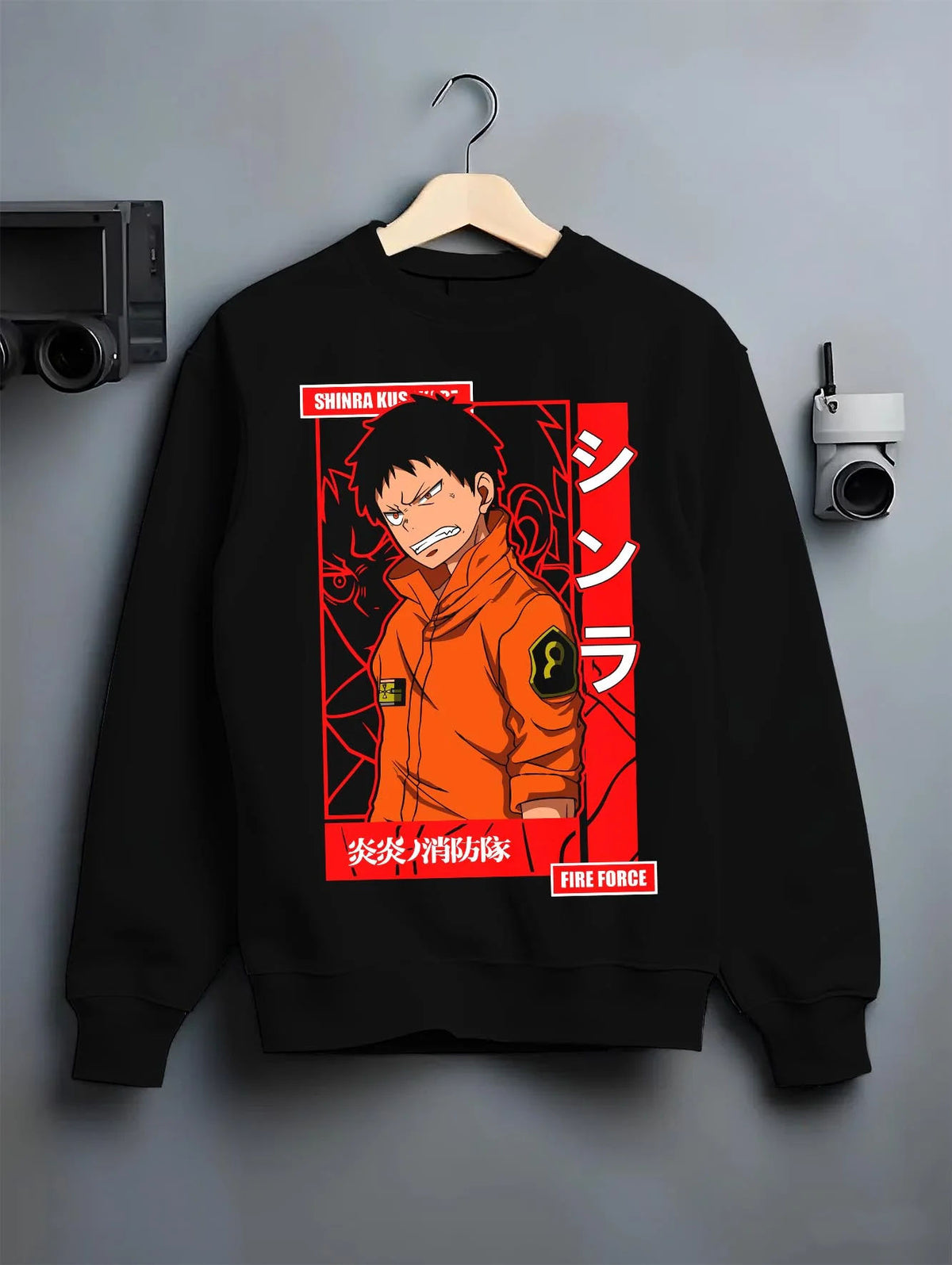Black crewneck sweatshirt on hanger featuring Shinra Kusakabe Fire Force hero artwork.
