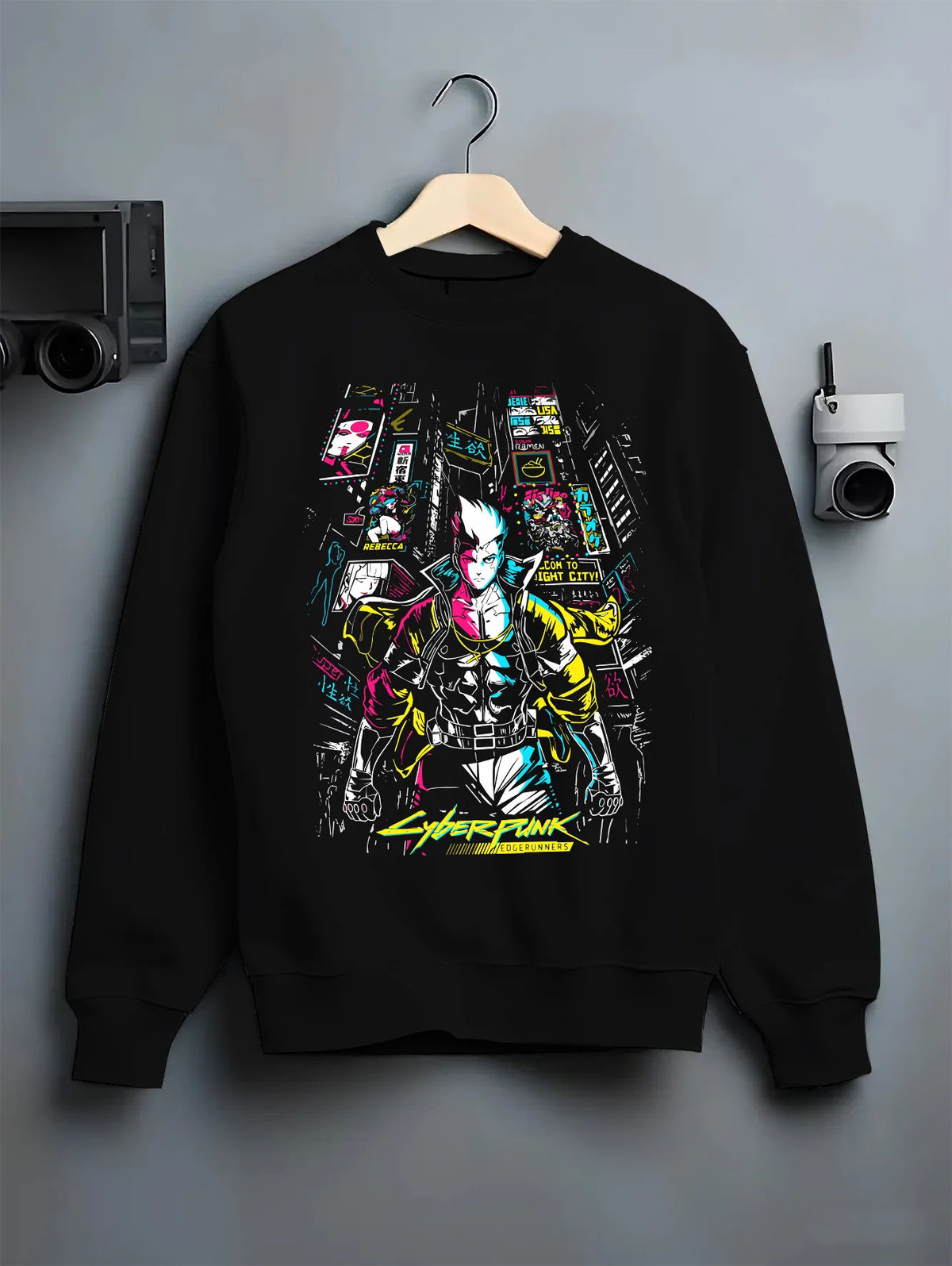 Black crewneck sweatshirt on hanger showing Cyberpunk from Cyberpunk: Edgerunners: neon city character composition