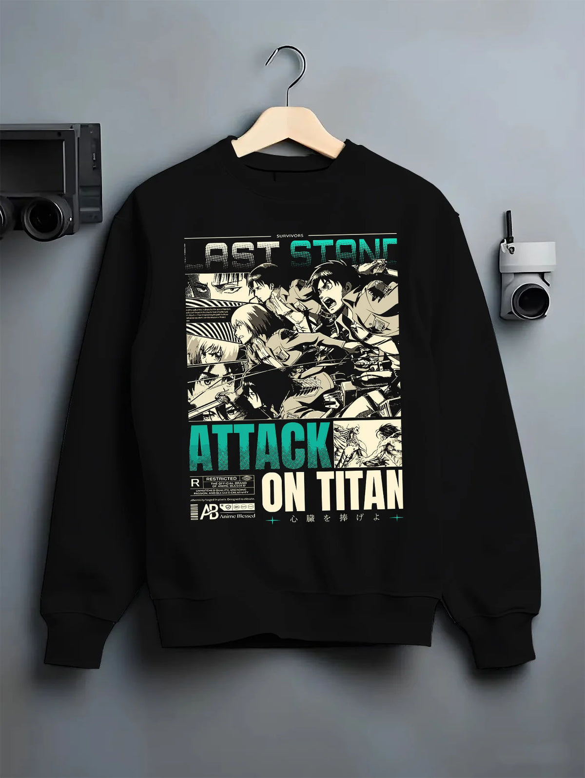Black crewneck sweatshirt on hanger showing Attack on Titan cast: vintage manga panel montage