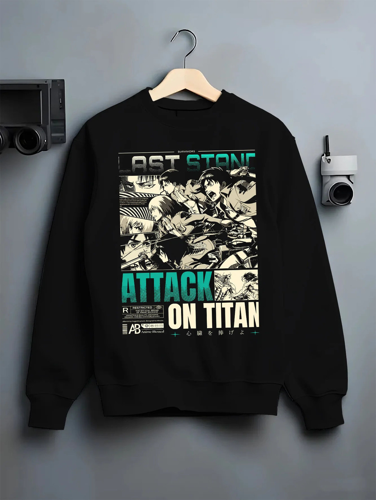 Black crewneck sweatshirt on hanger showing Attack on Titan cast: vintage manga panel montage