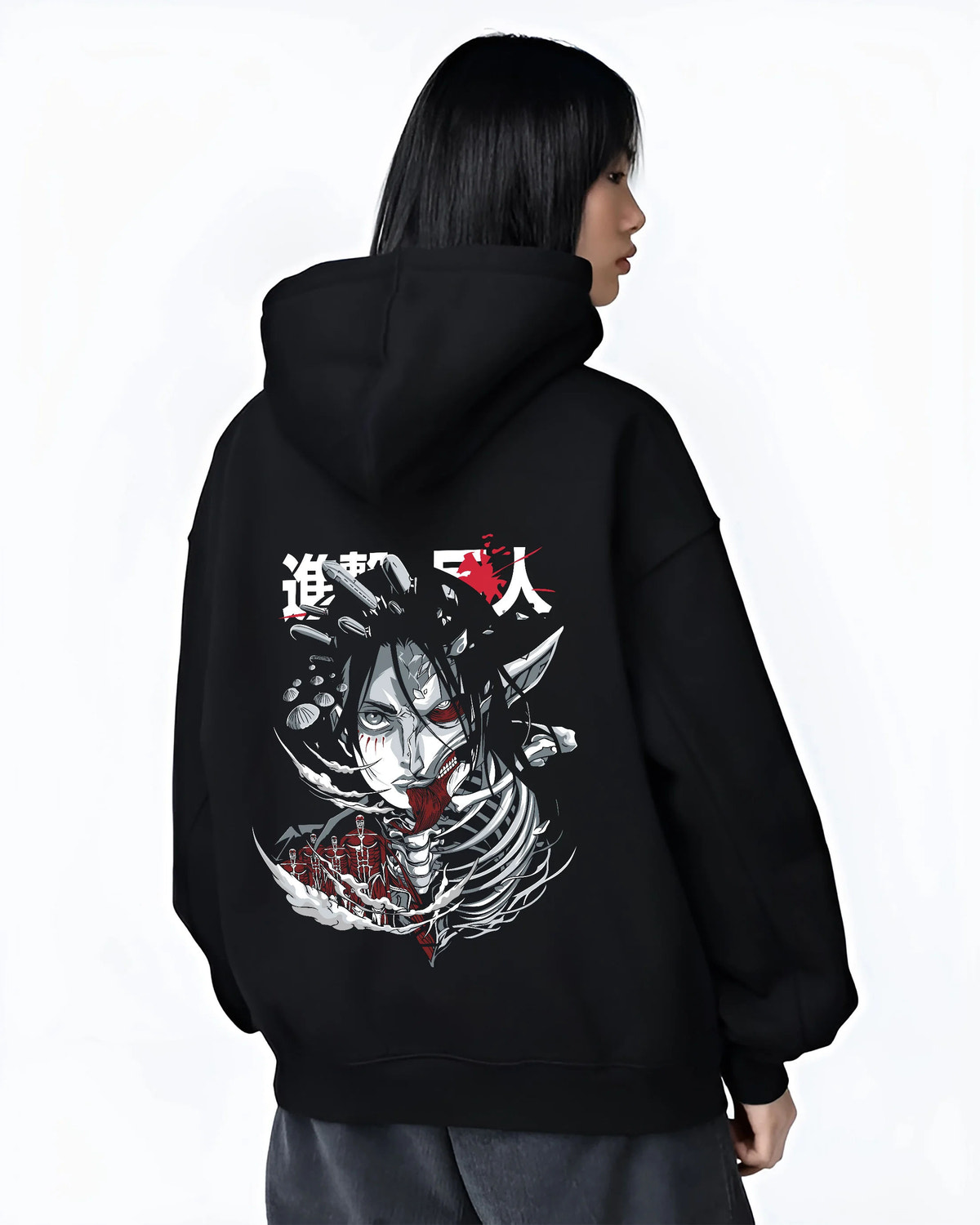 Black hoodie female model back view showing Eren / Attack Titan from Attack on Titan: dark skeletal monster head