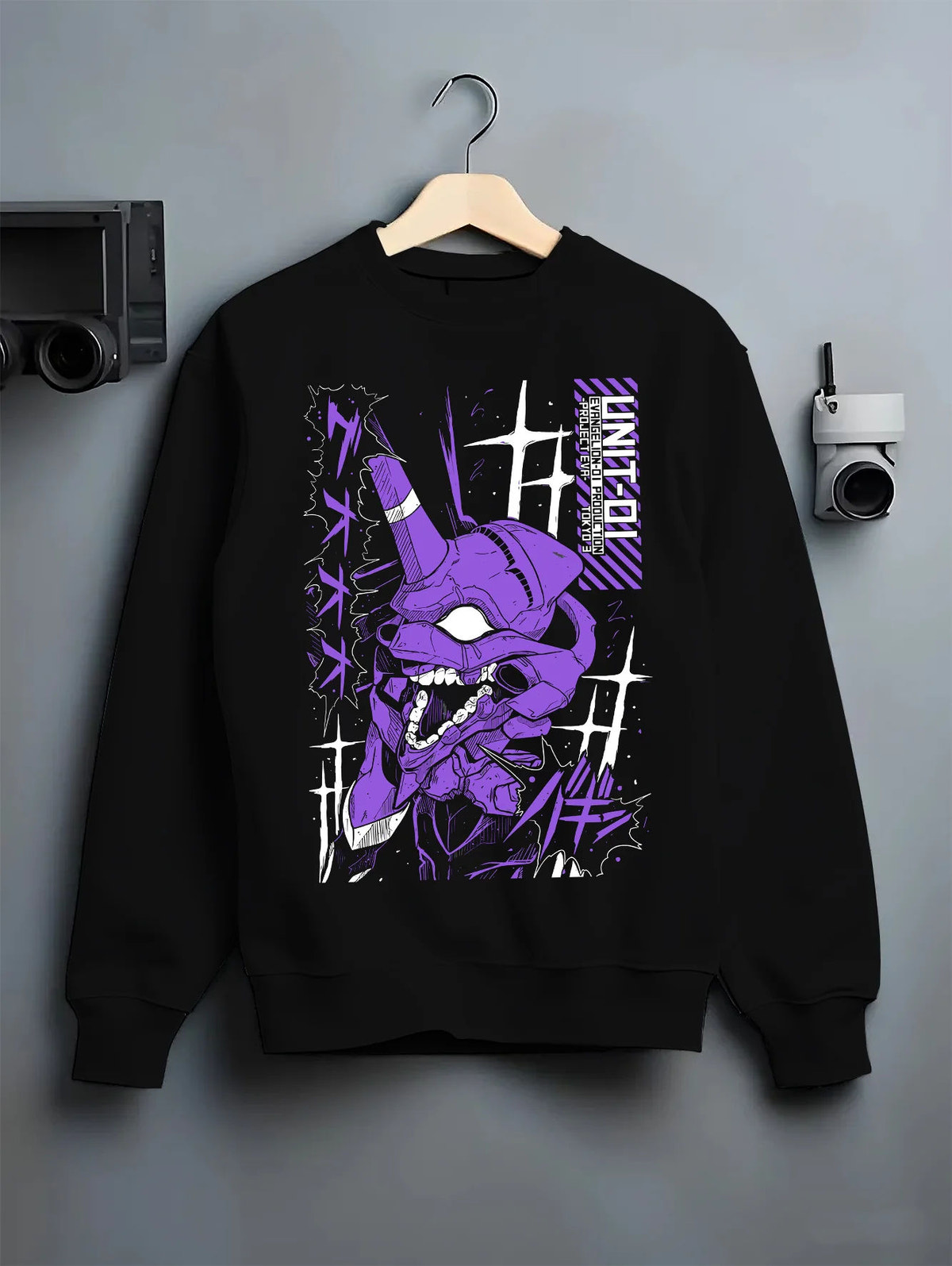 Black crewneck sweatshirt on hanger showing Evangelion Unit-01: purple mecha portrait