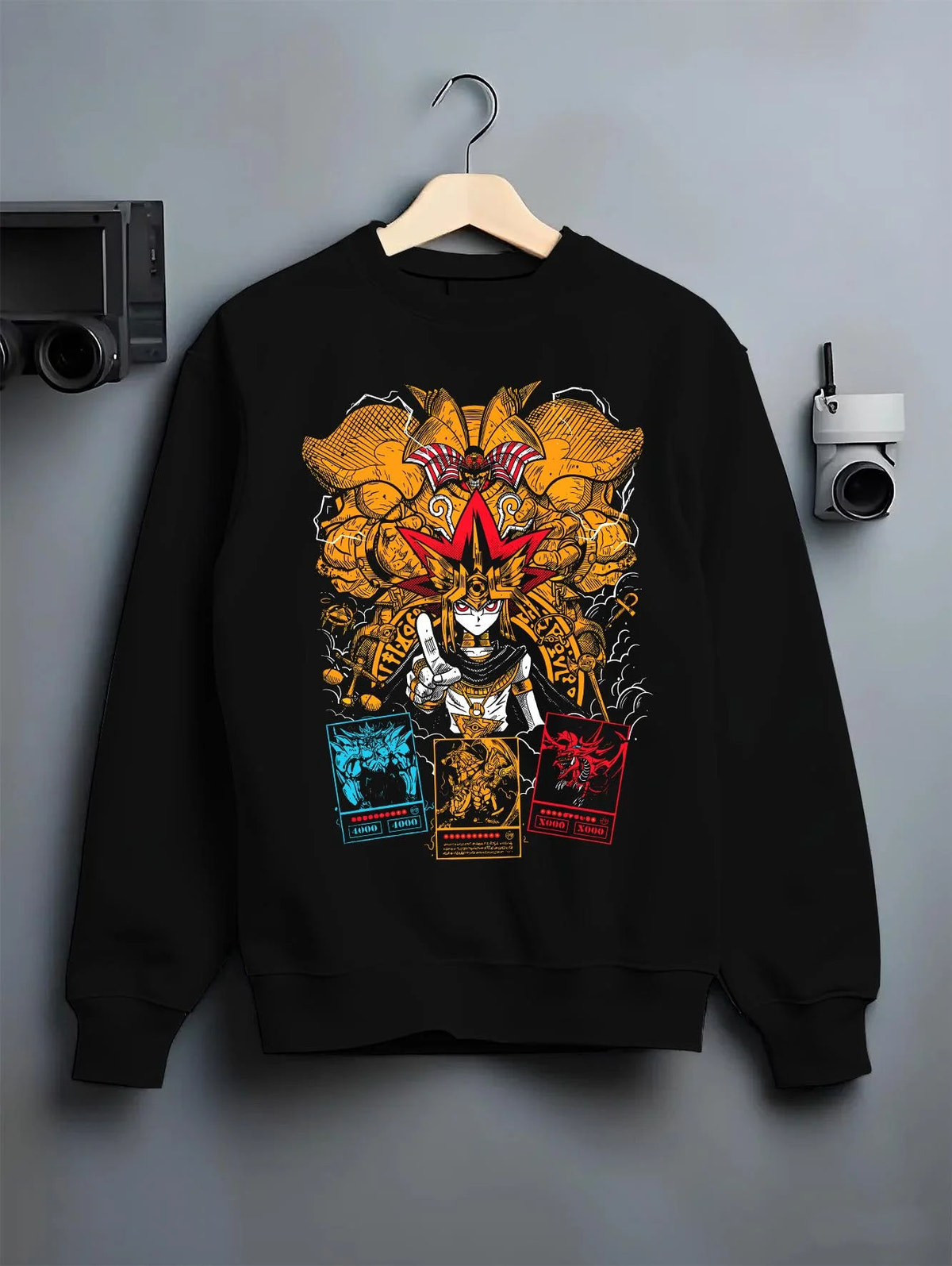 Black crewneck sweatshirt on hanger featuring Exodia Yu-Gi-Oh forbidden power artwork.