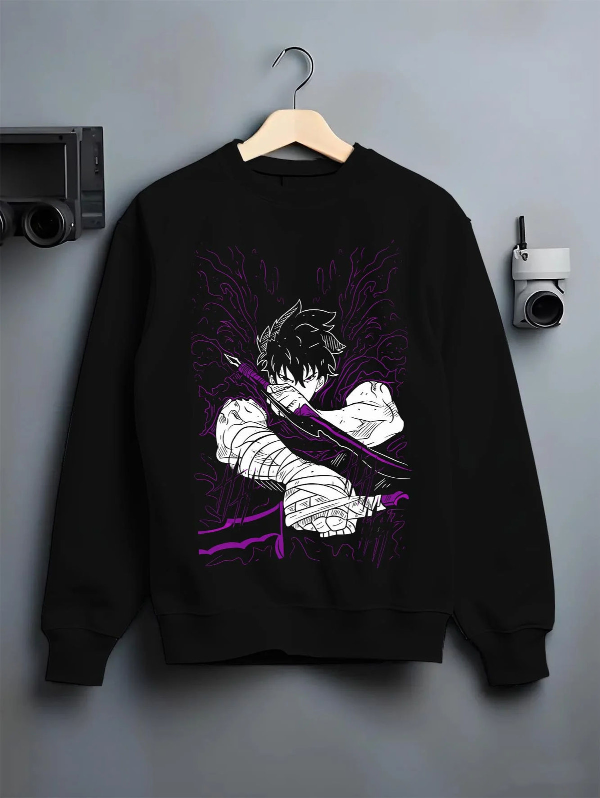 Black crewneck sweatshirt on hanger featuring Ken Kaneki Tokyo Ghoul dark awakening artwork.