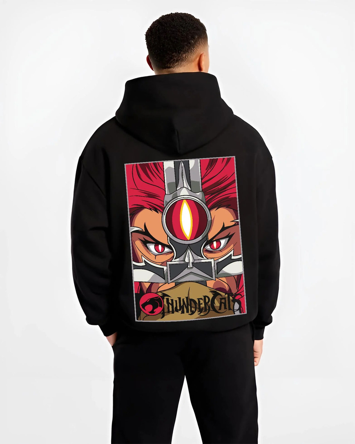 Black hoodie worn by male model from the back featuring Thundercats Eye of Thundera artwork.