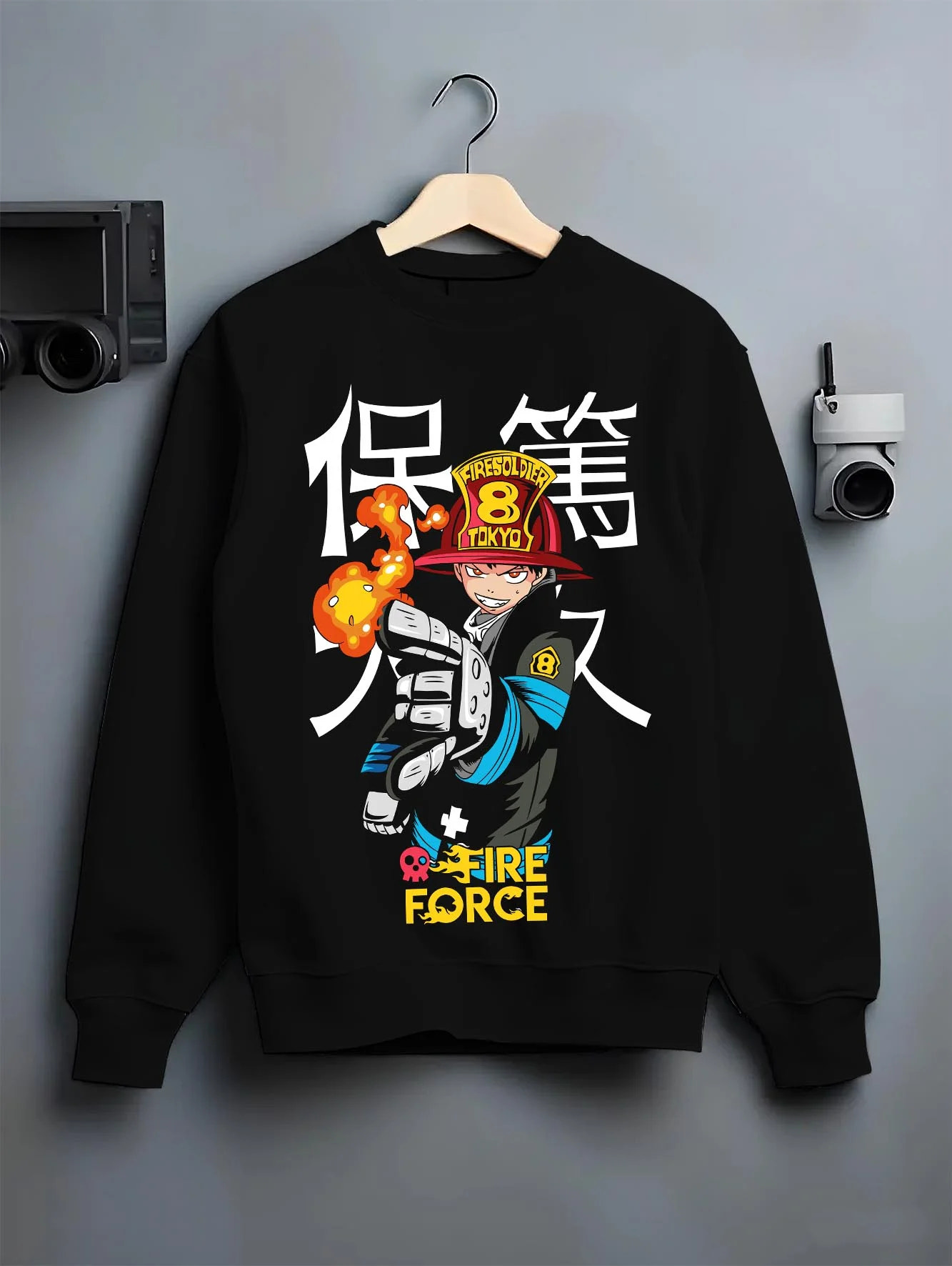 Black crewneck sweatshirt on hanger with Fire Force Hoodie Shinra Kusakabe Fire Blast Stance graphic premium wear.