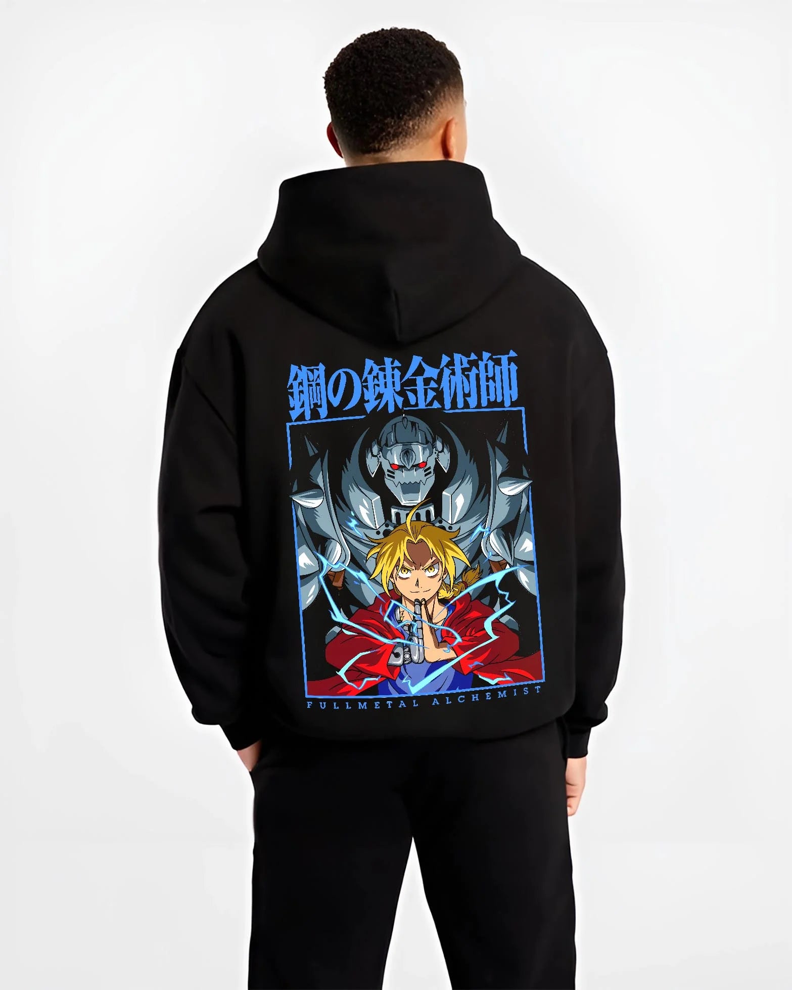 Black hoodie worn by male model, back view with Edward Elric Hoodie Fullmetal Alchemist Anime Panel graphic bold anime graphic.