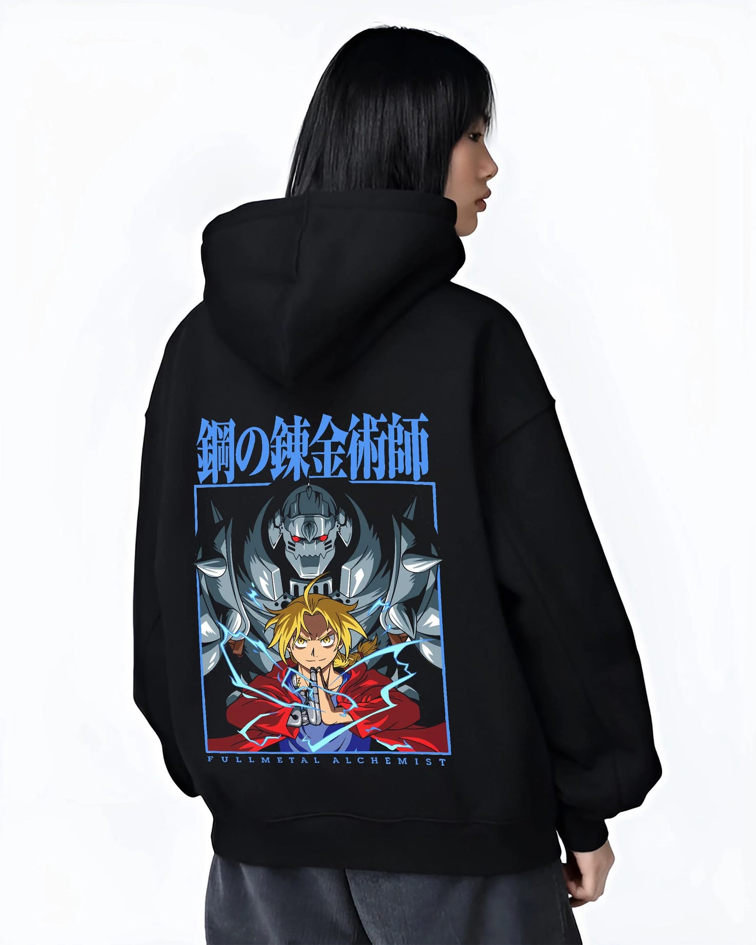 Black hoodie worn by female model, back view with Edward Elric Hoodie Fullmetal Alchemist Anime Panel graphic streetwear graphic.